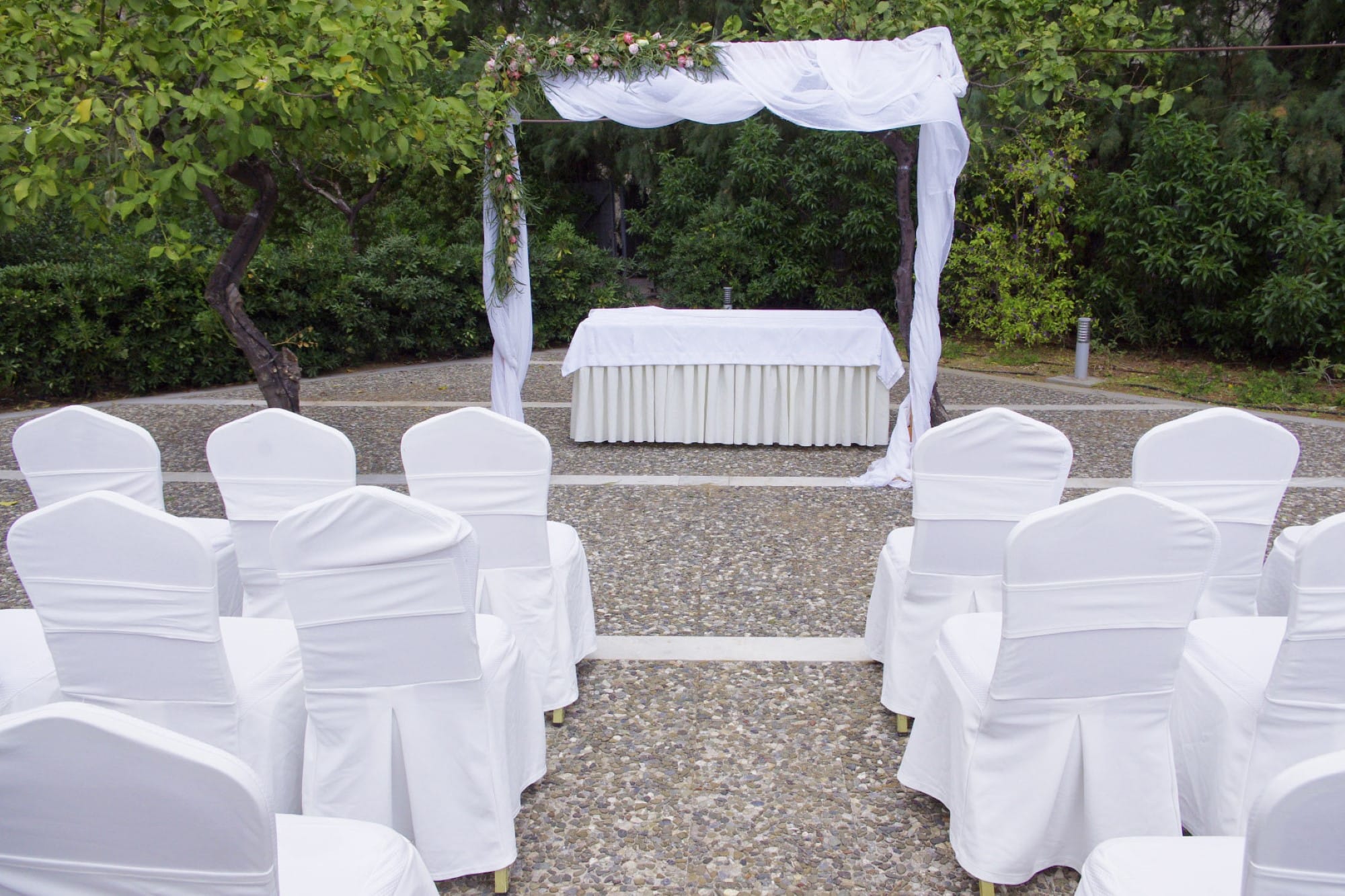 a group of white chairs outside