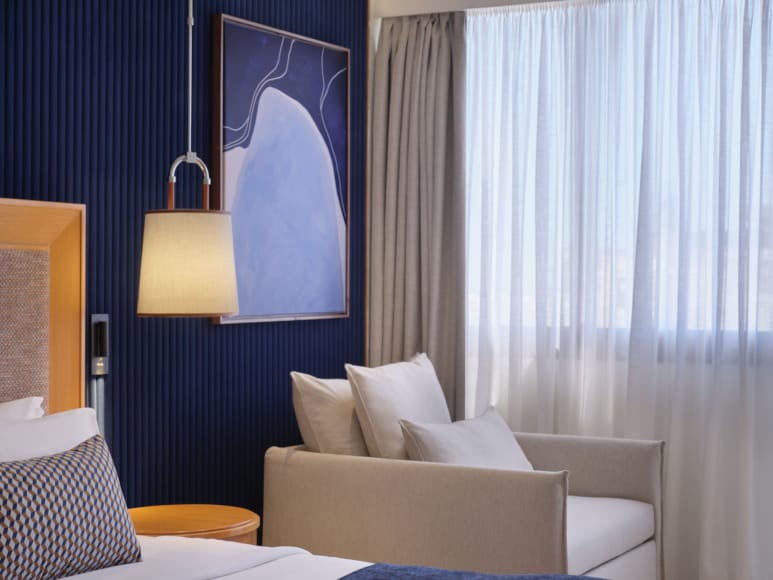 a room with a couch and a lamp