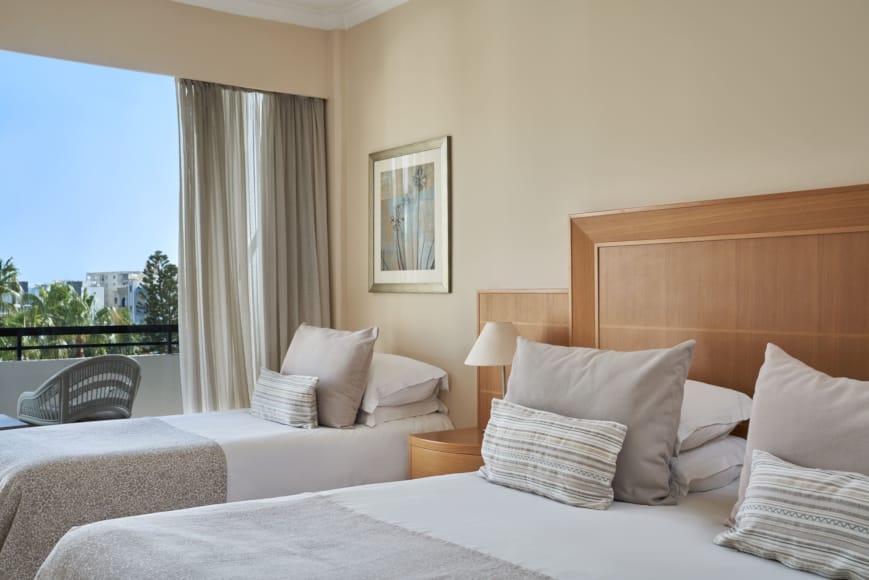a bedroom with a large window