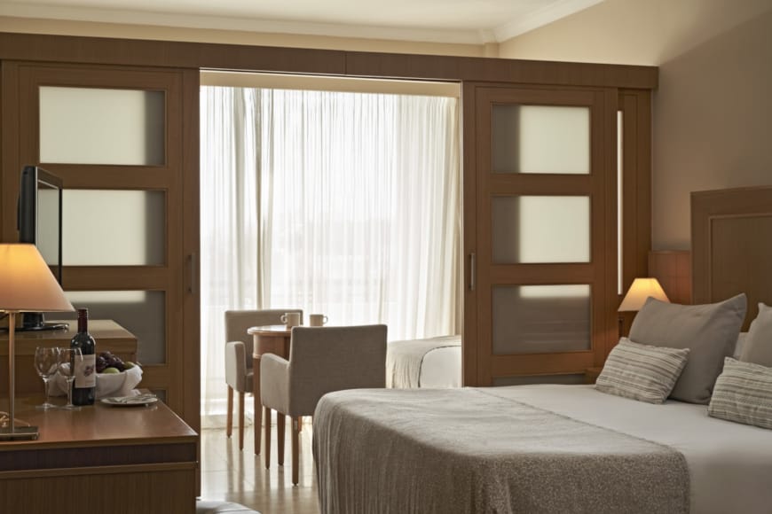 a hotel room with a bed and a table