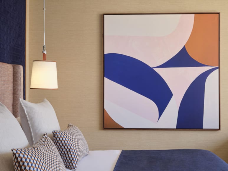 a room with a bed and a lamp