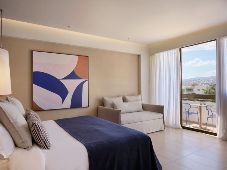 a bedroom with a large window