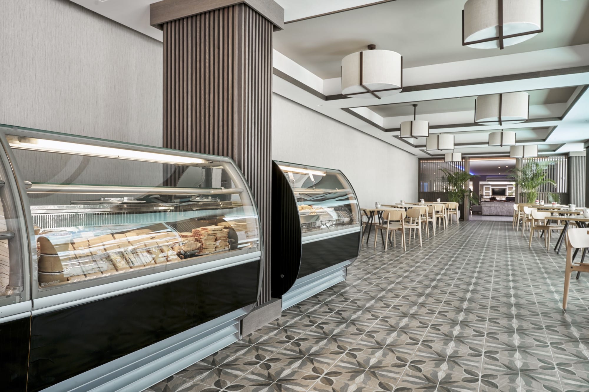 Modern Buffet Area With Pastry Displays And Spacious Seating At Atlantica Oasis Hotel In Limassol