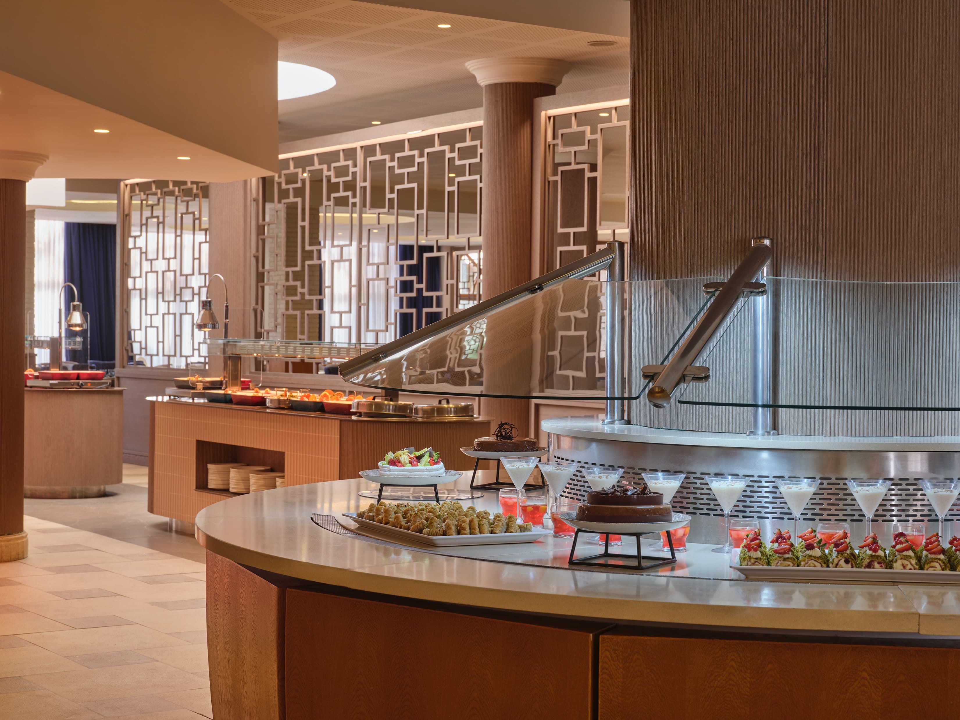 Modern Buffet Station With Dessert Displays And Island Counters At Atlantica Oasis Hotel In Limassol