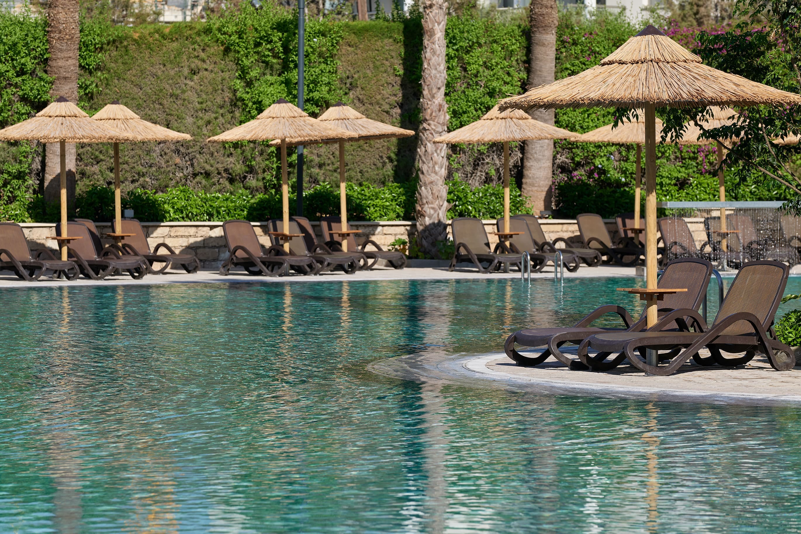 Relaxing Outdoor Pool Area At The Atlantica Oasis Hotel In Limassol, Cyprus.