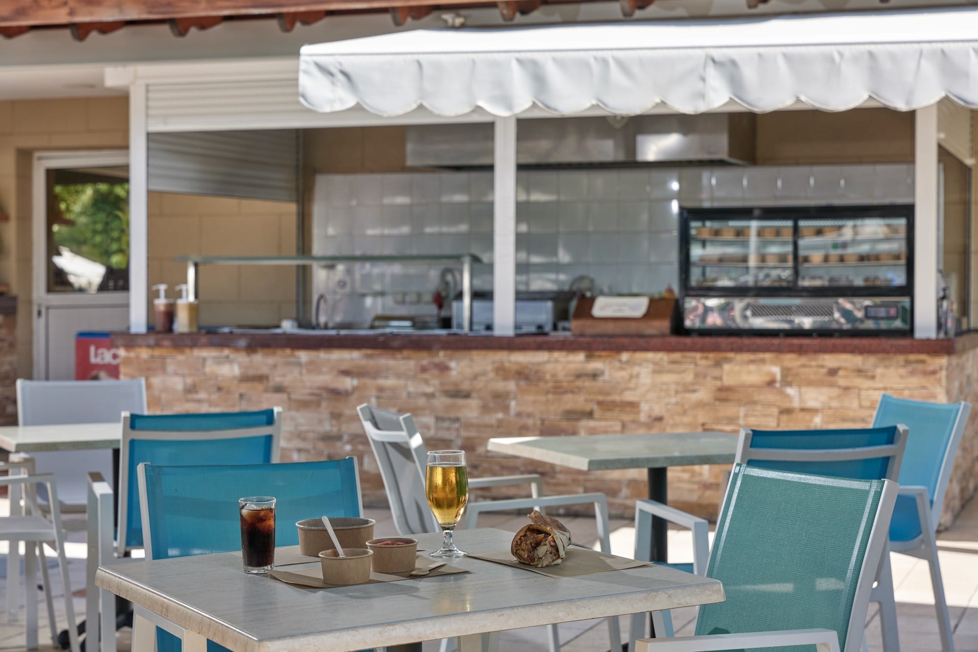 a table with a glass of liquid on it