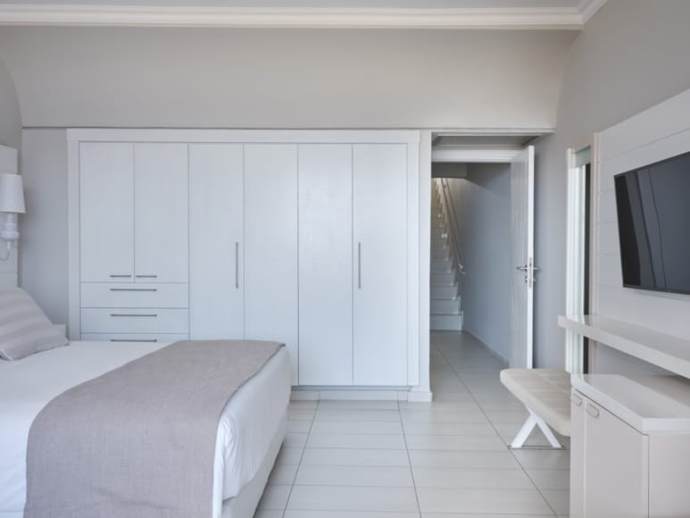 a room with white cabinets