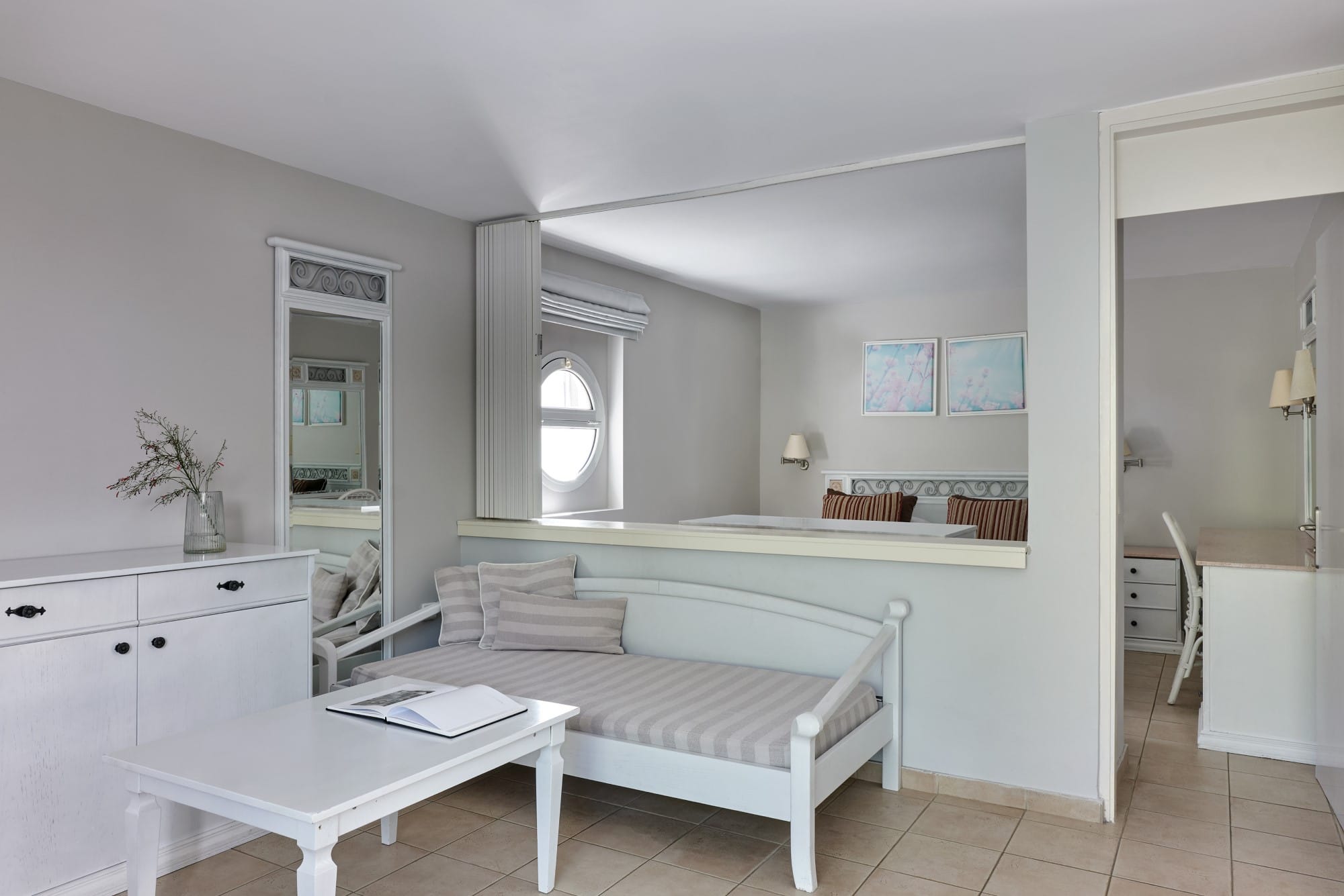 a large bedroom with a bed and a desk