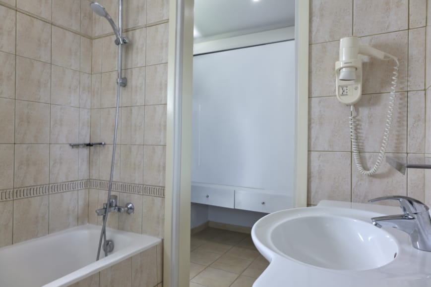 a bathroom with a sink and shower