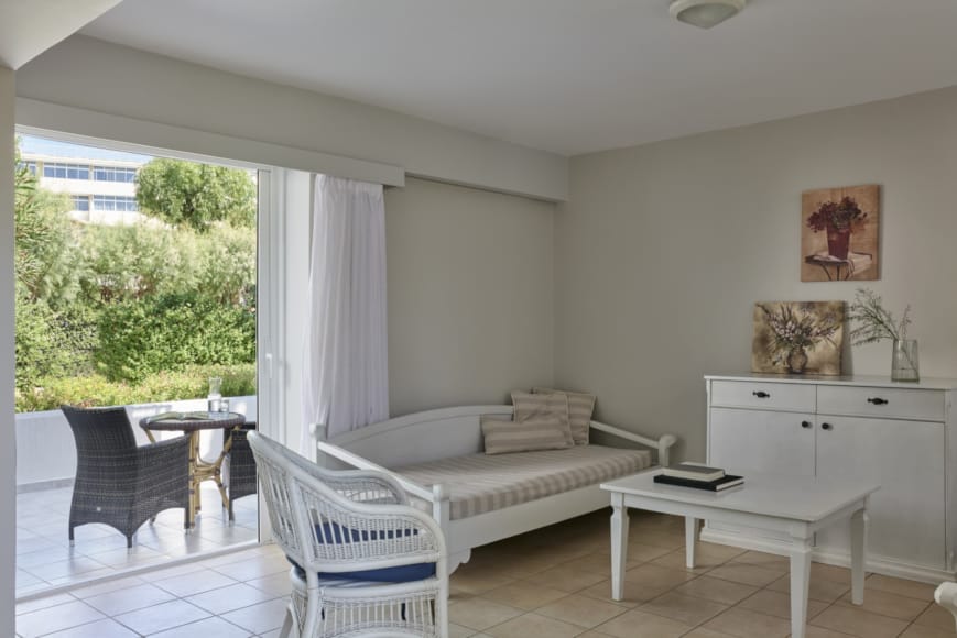 a living room with a white couch and a table