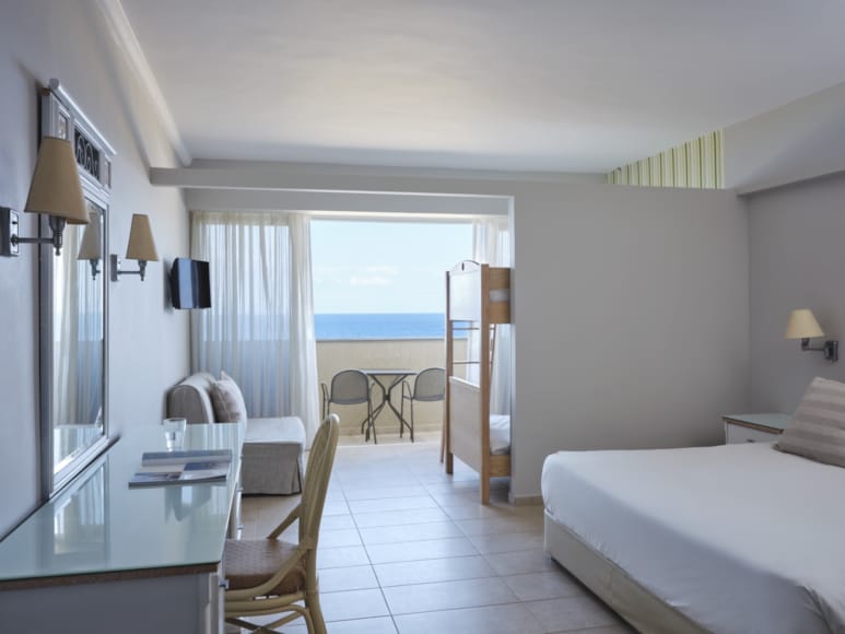 a hotel room with a view of the ocean