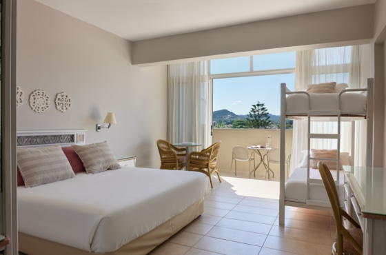 a bedroom with a large window