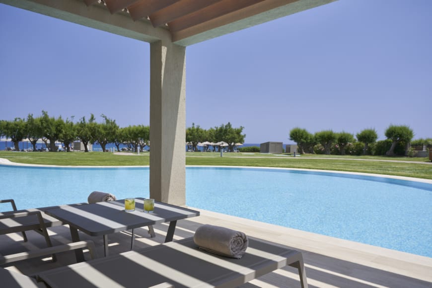 a pool with chairs around it