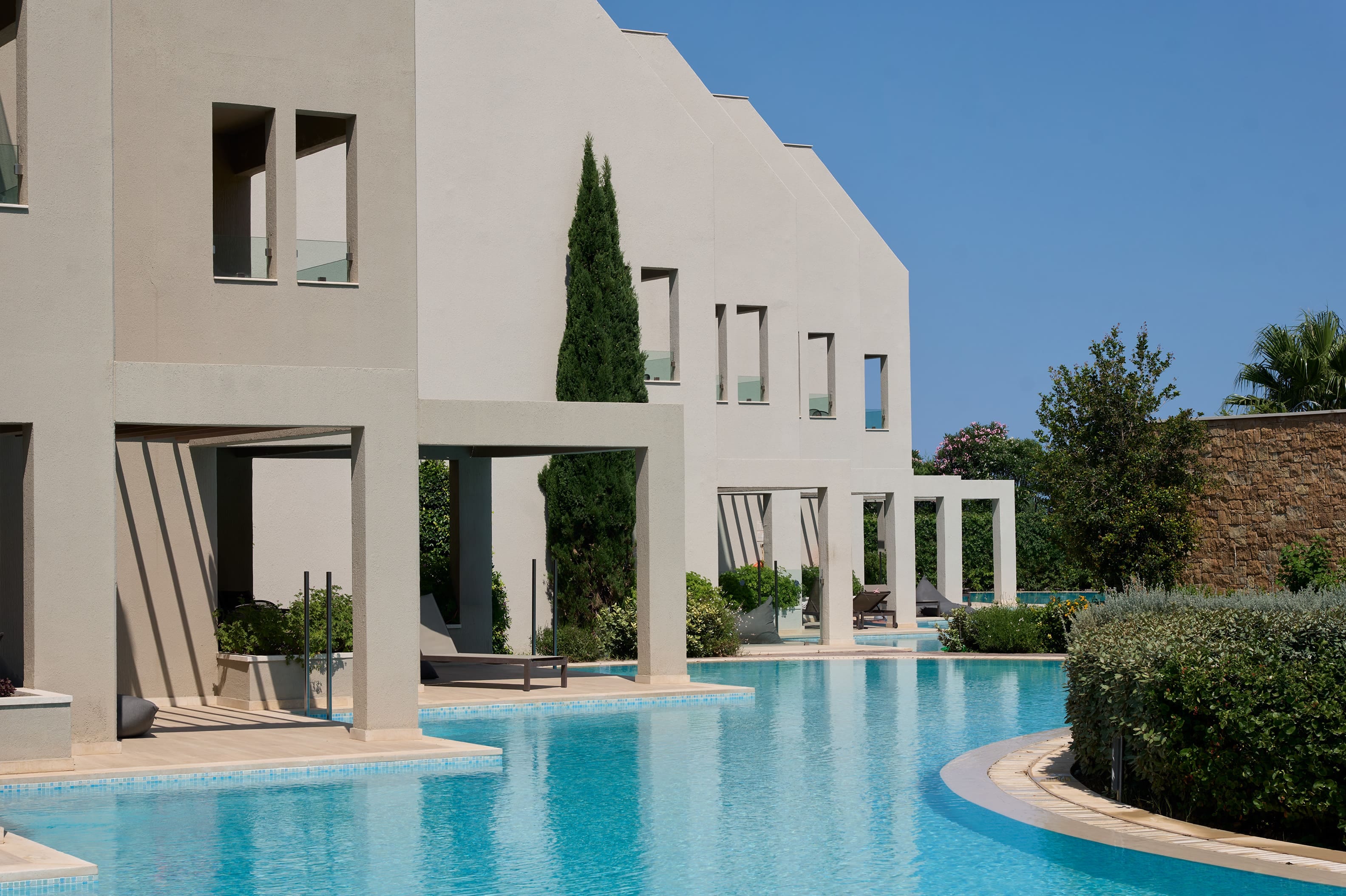 a white house with a pool