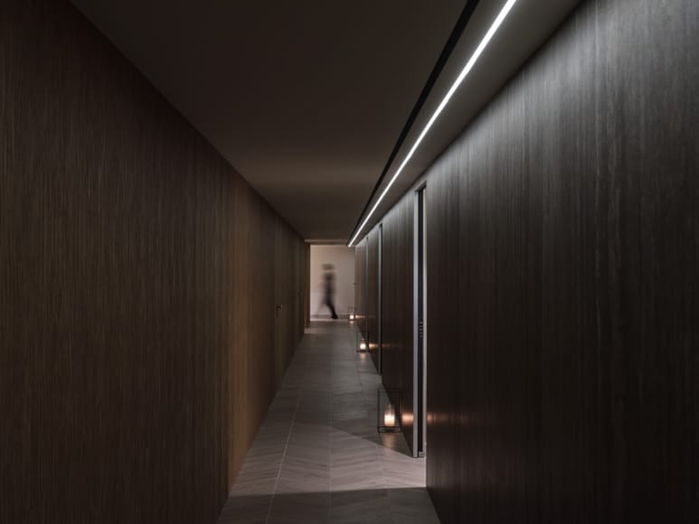 a person walking down a hallway