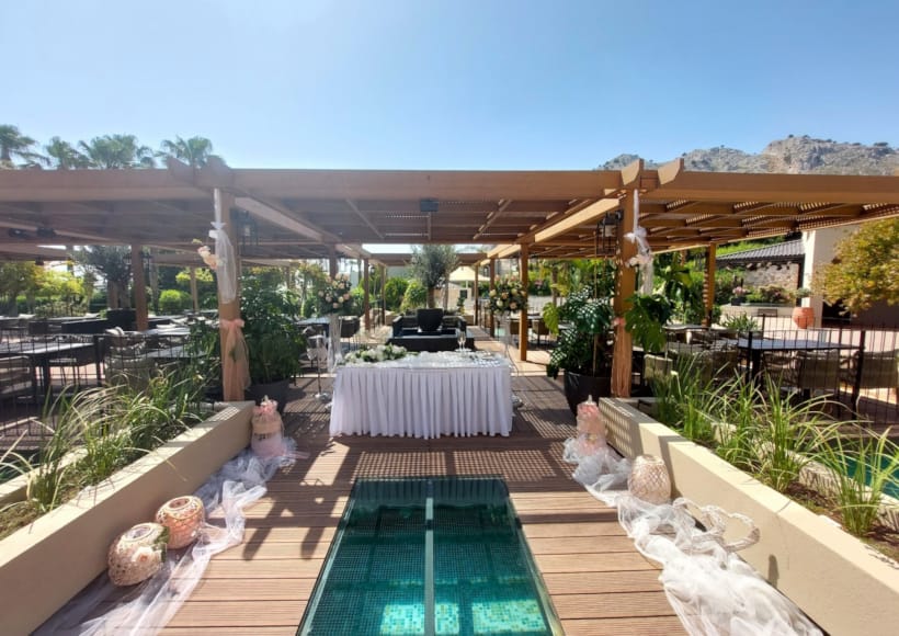 a deck with a pool and a covered patio with a covered area