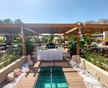 a deck with a pool and a covered patio with a covered area