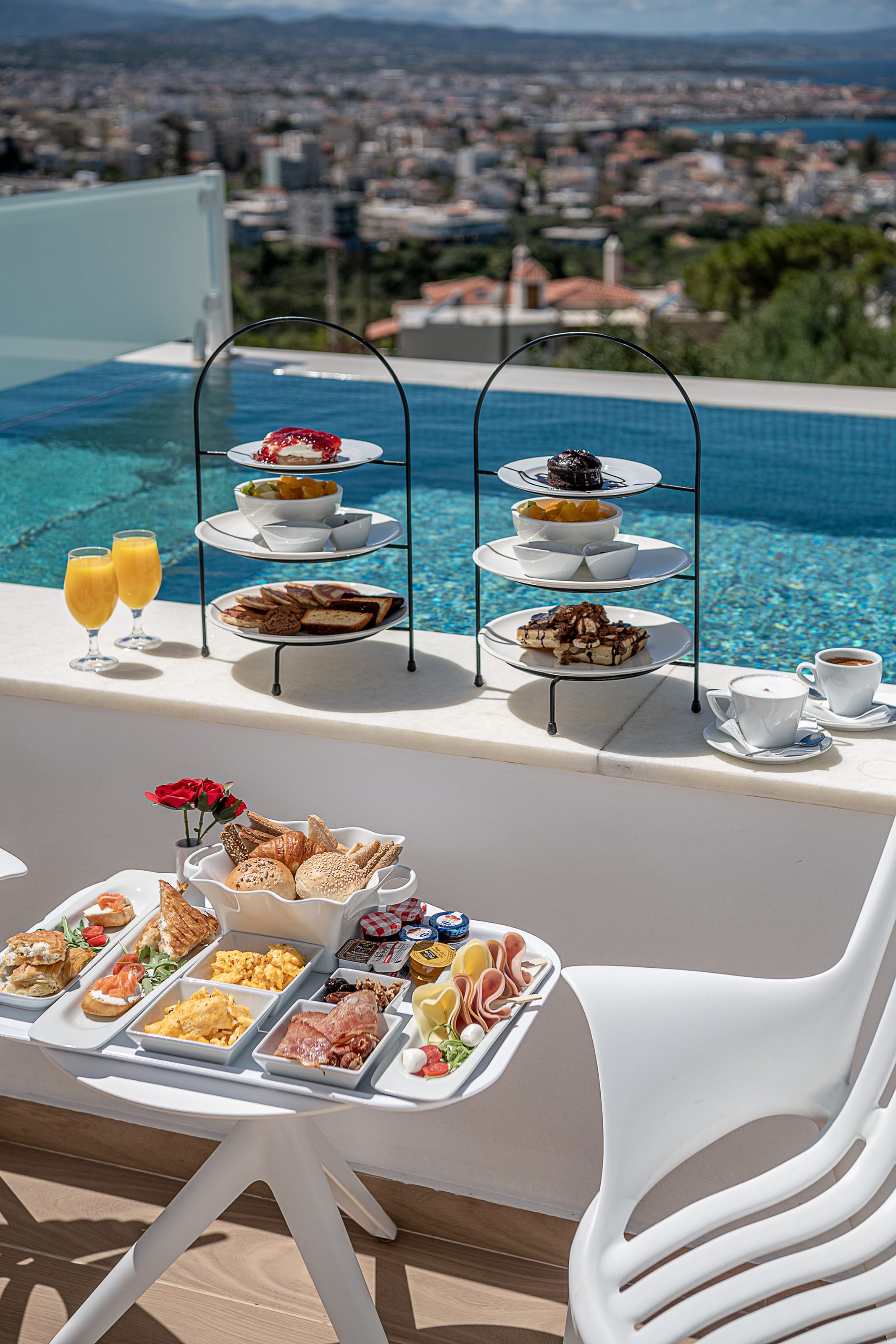 a table with food on it by a pool