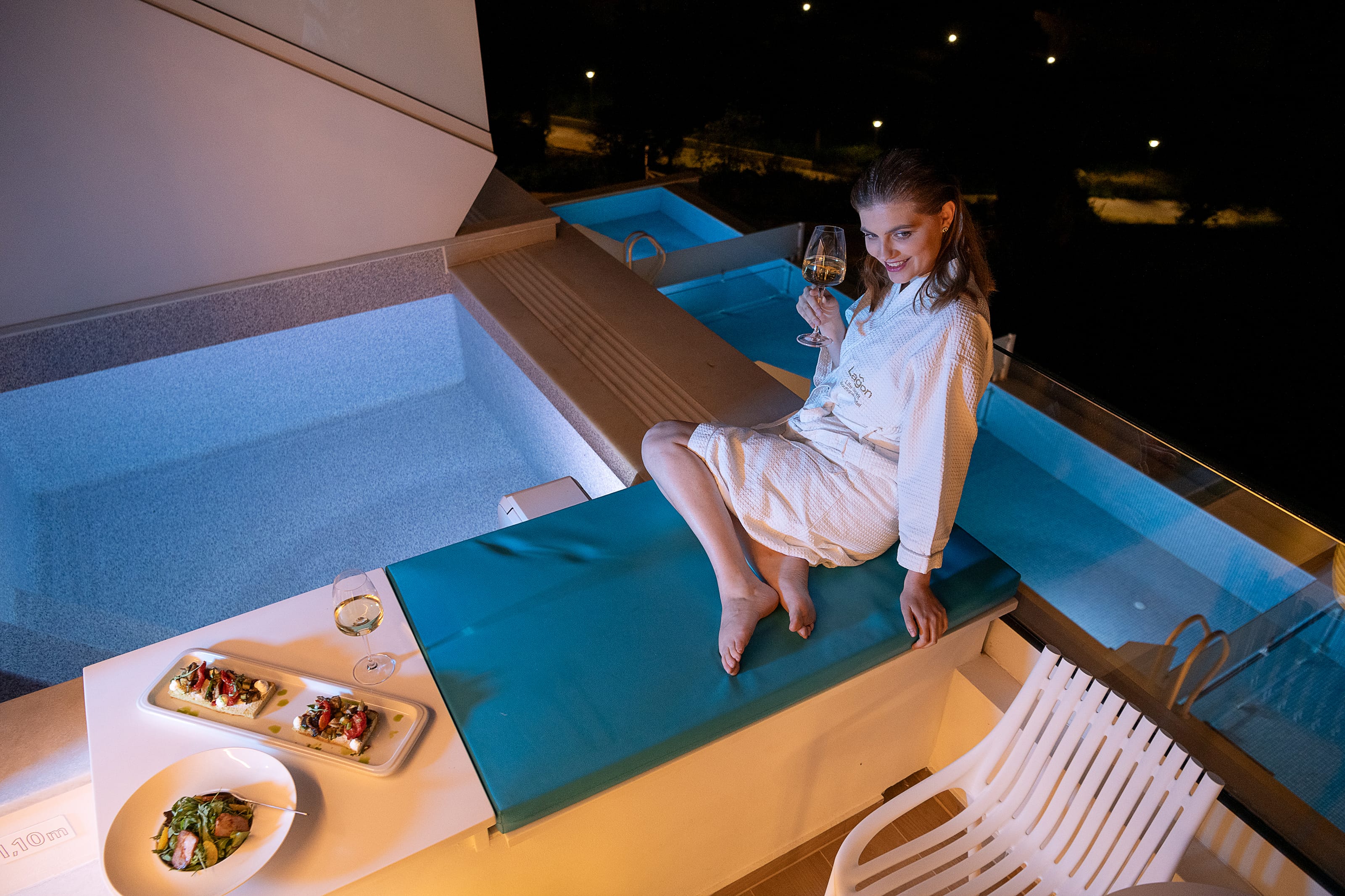 a girl sitting on a bed