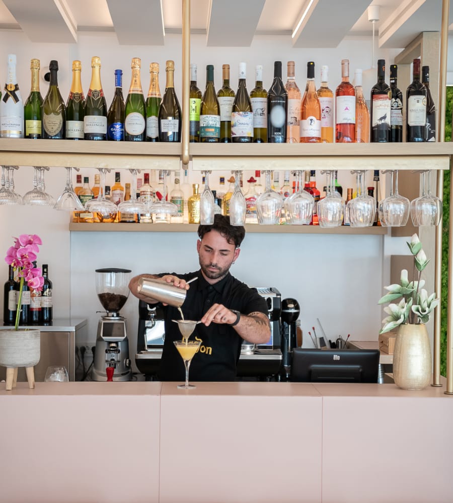 a person holding a glass of wine
