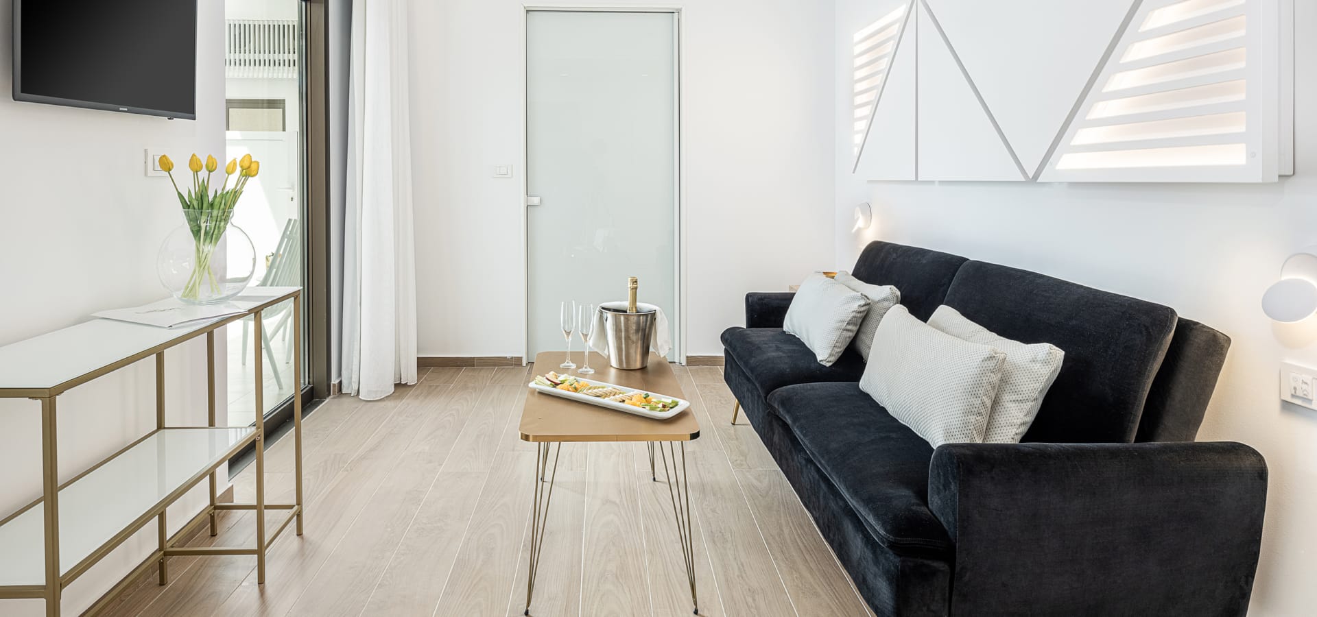 a living room with a black couch