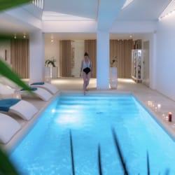 a person walking in a swimming pool