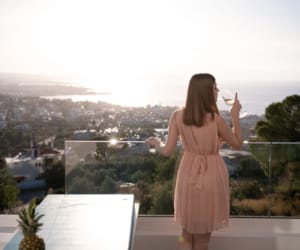 a woman standing on a balcony