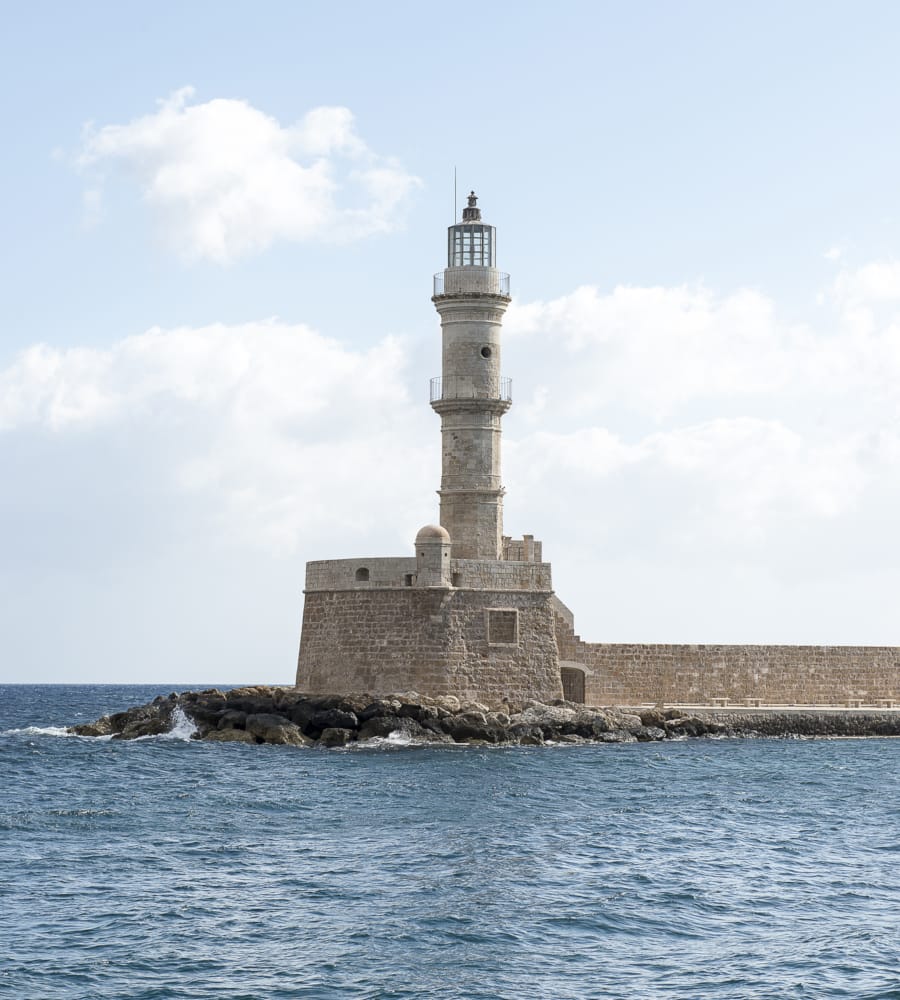 a lighthouse on a rocky island
