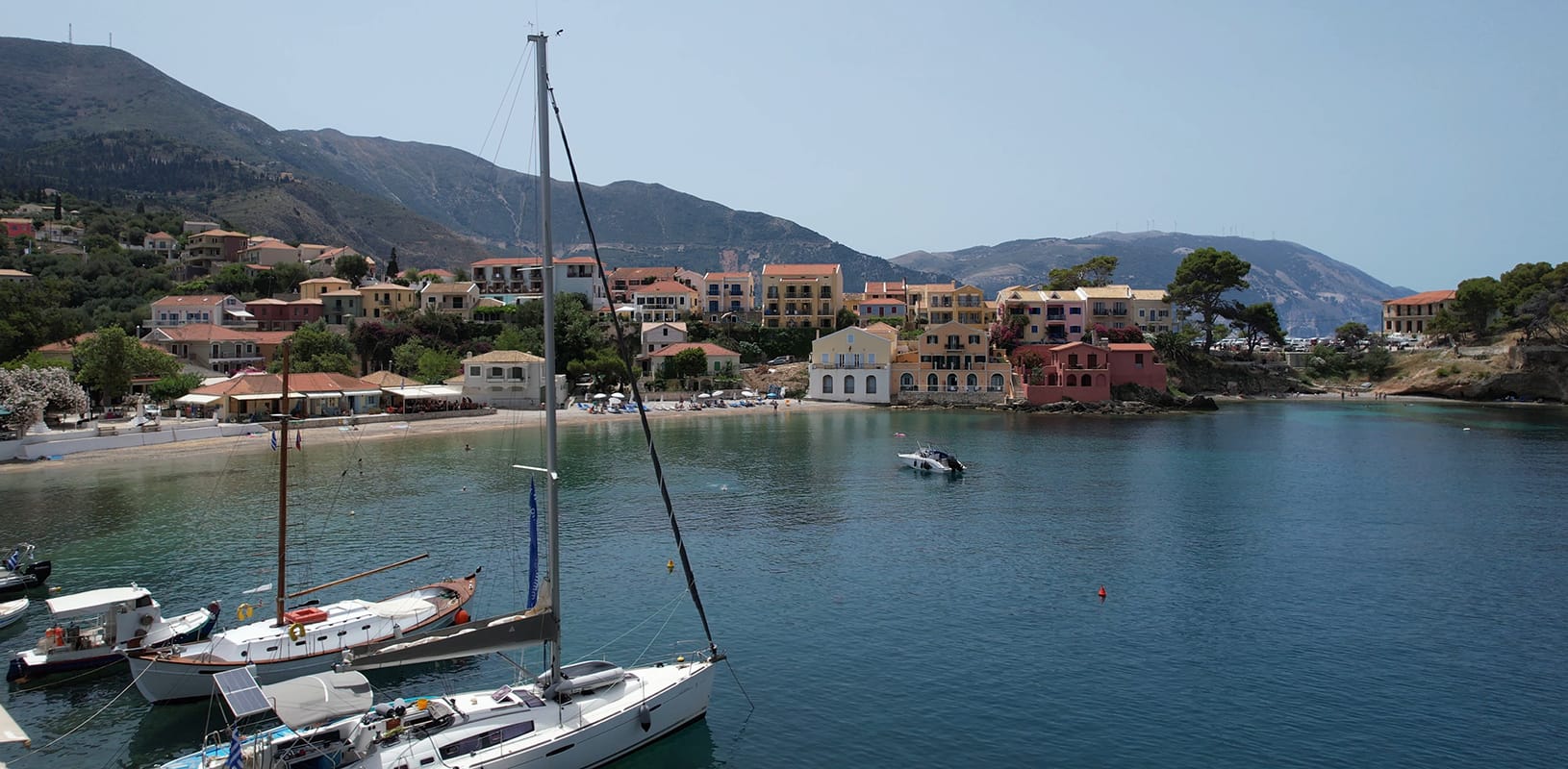a body of water with boats and buildings along it