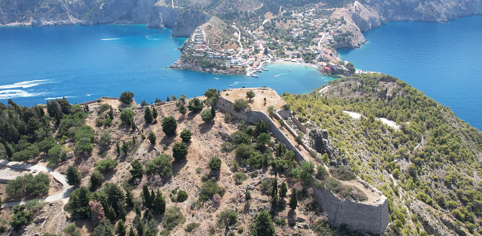 a landscape with a body of water and land with trees