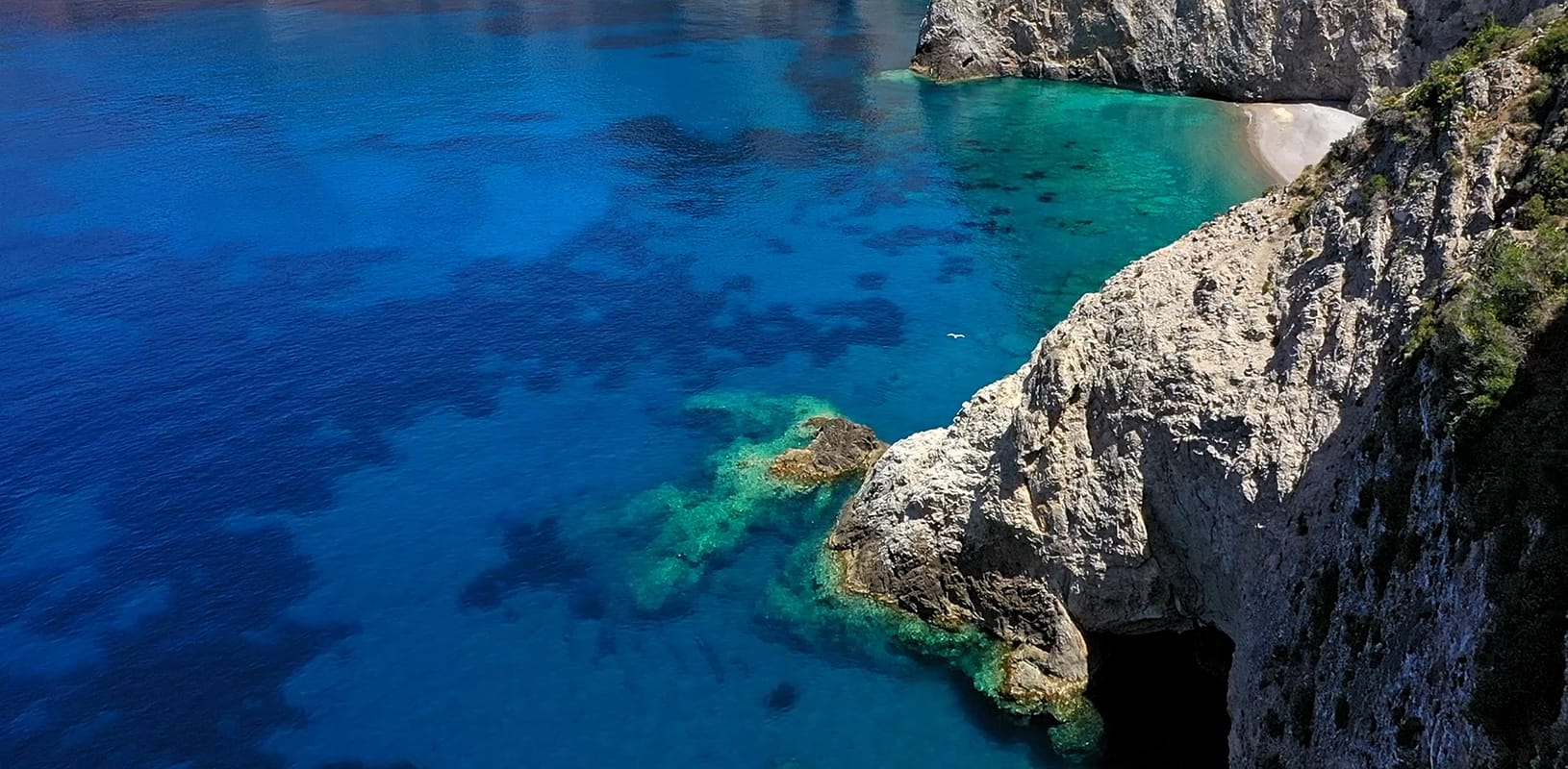 a large rock in the water