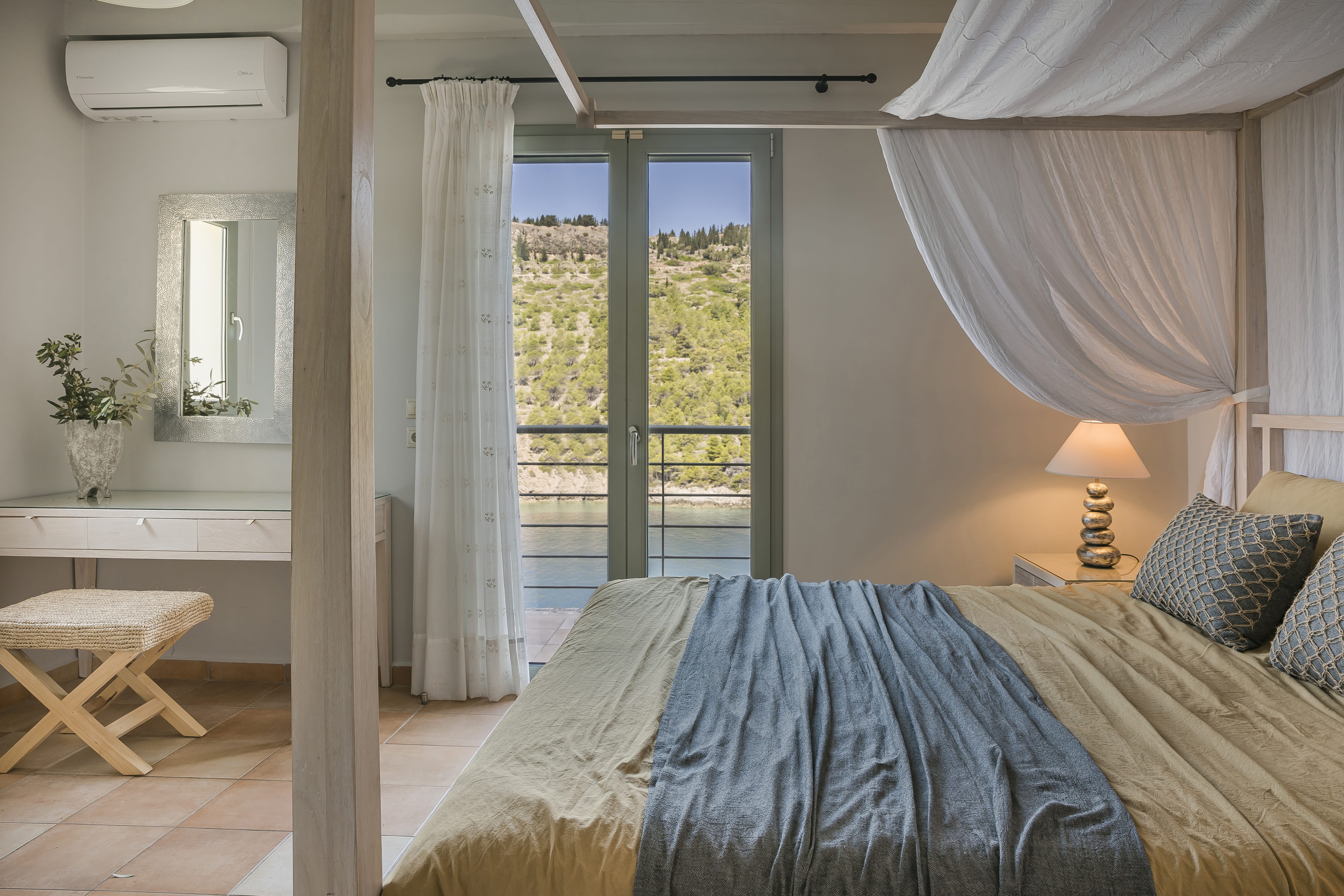 a bedroom with a large window