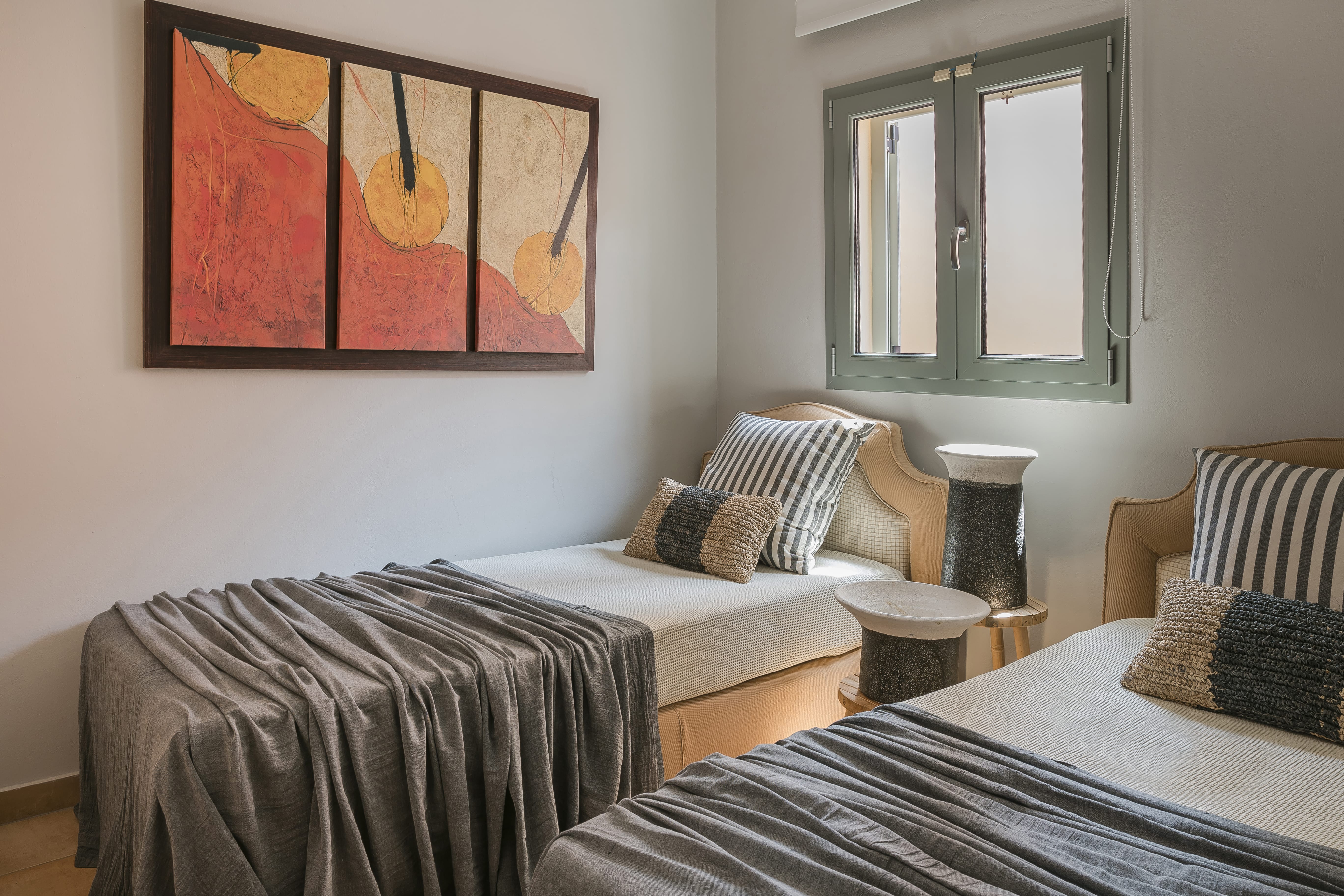 a couple of beds in a room