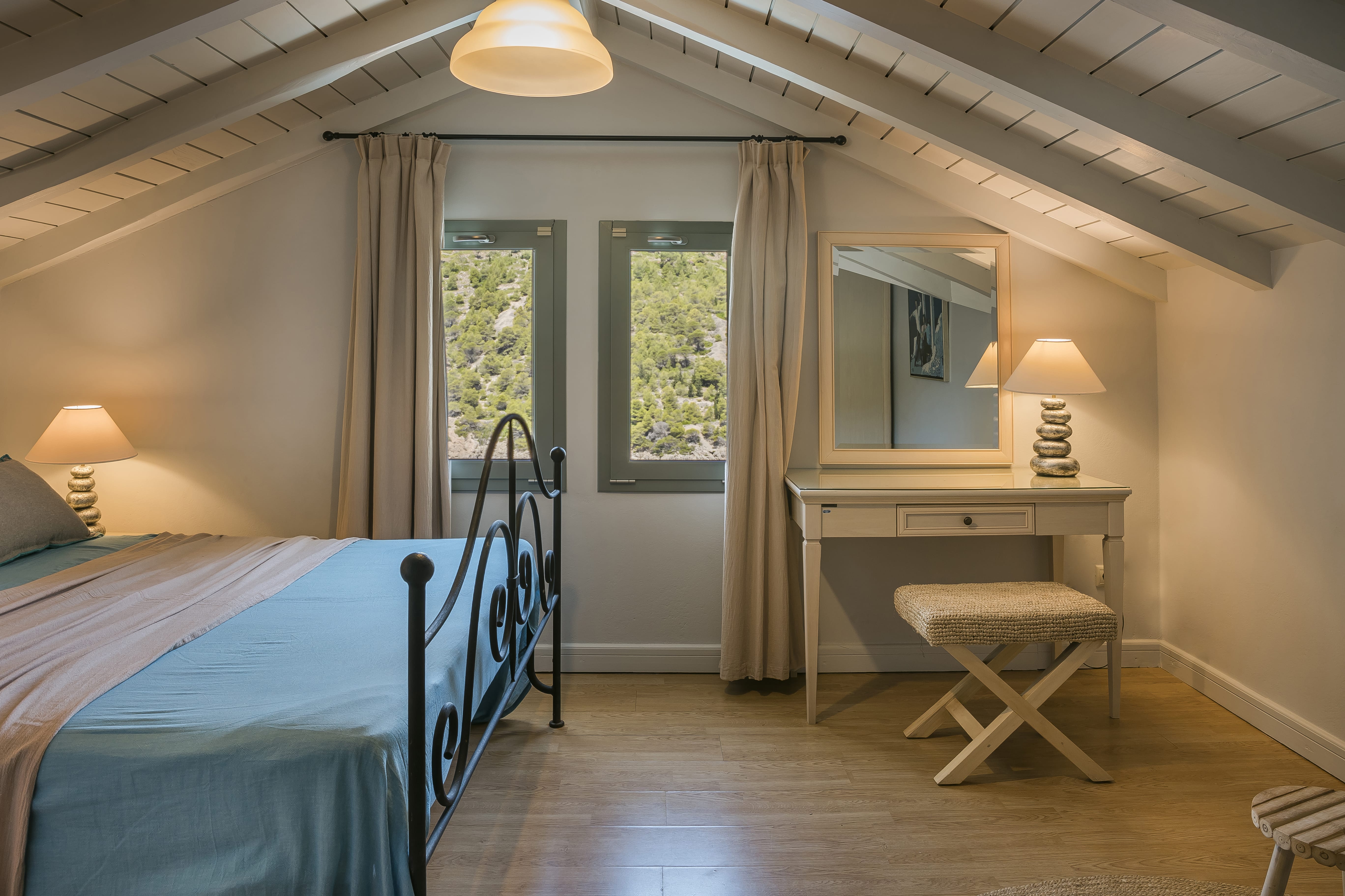 a bedroom with a bed and a mirror