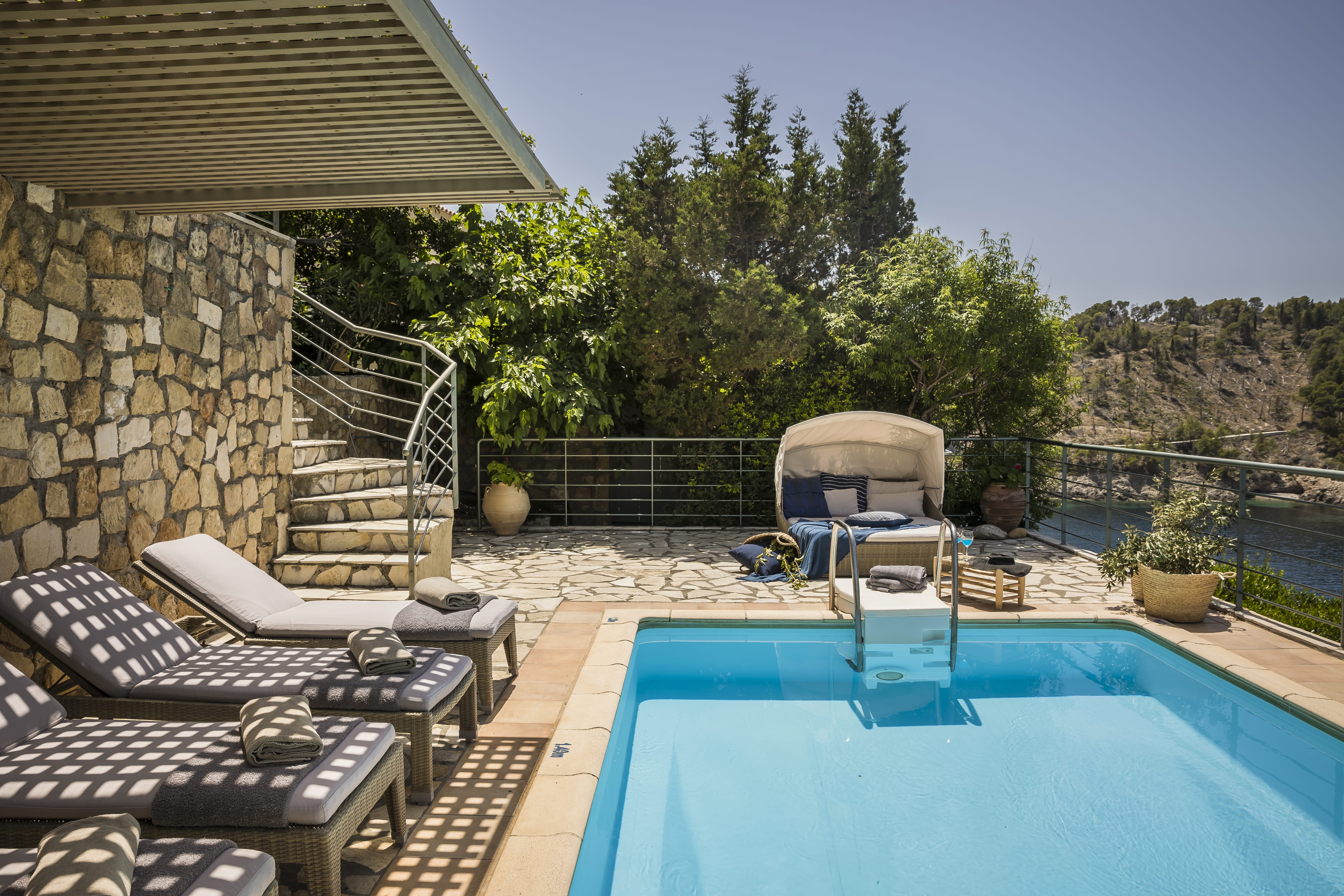 a pool with chairs and a deck