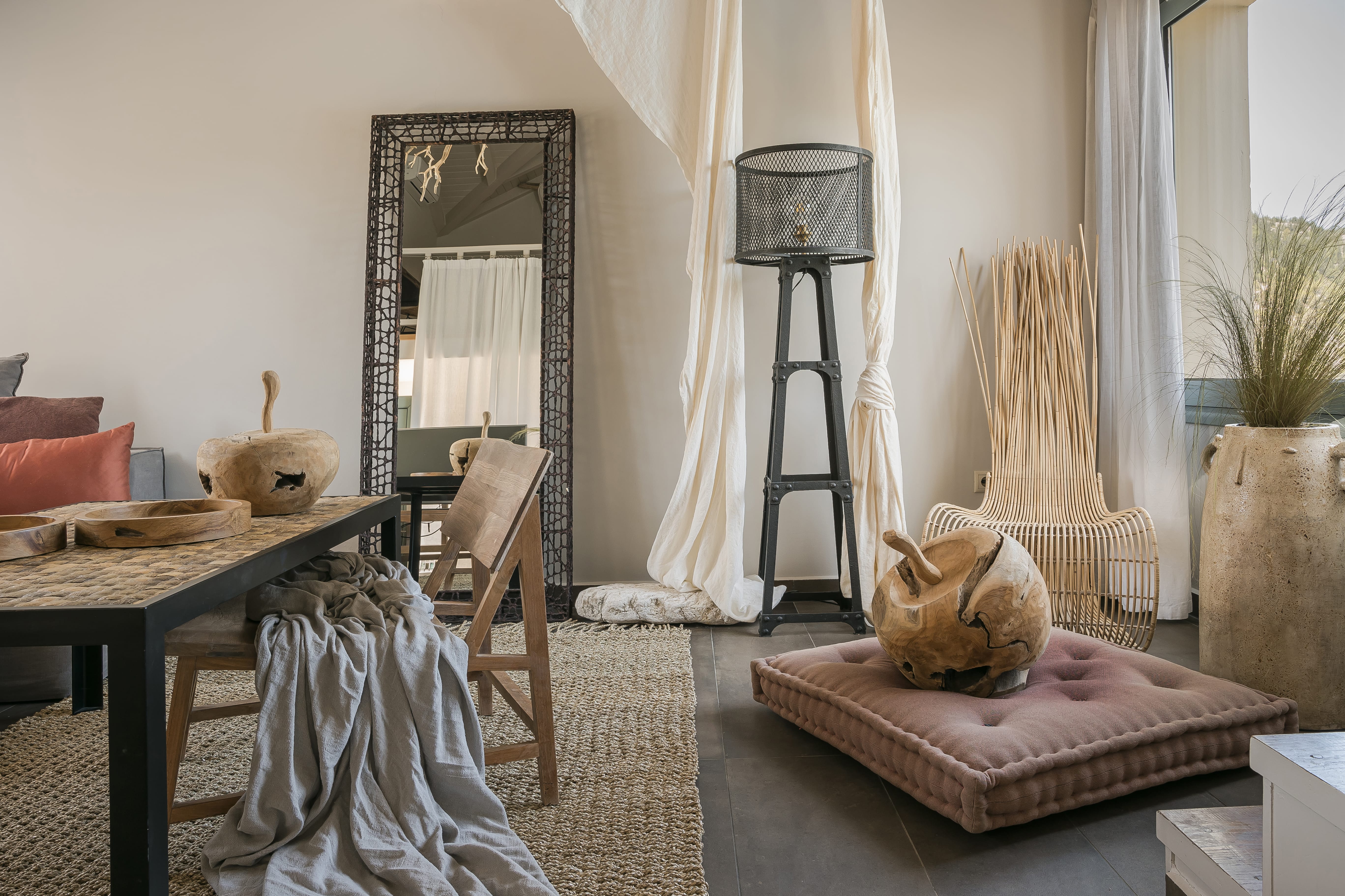 a living room with a table and chairs