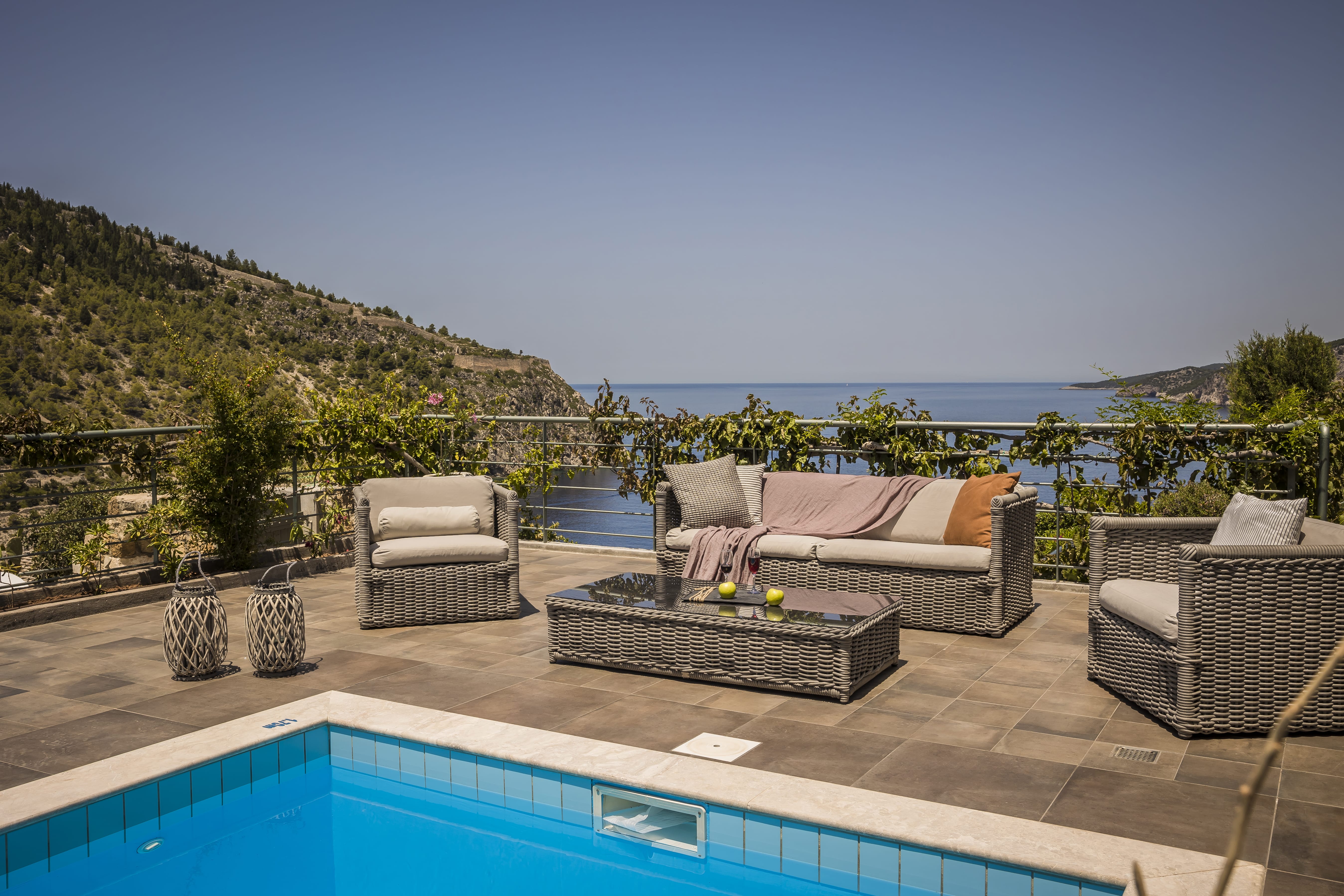 a pool with chairs and a couch