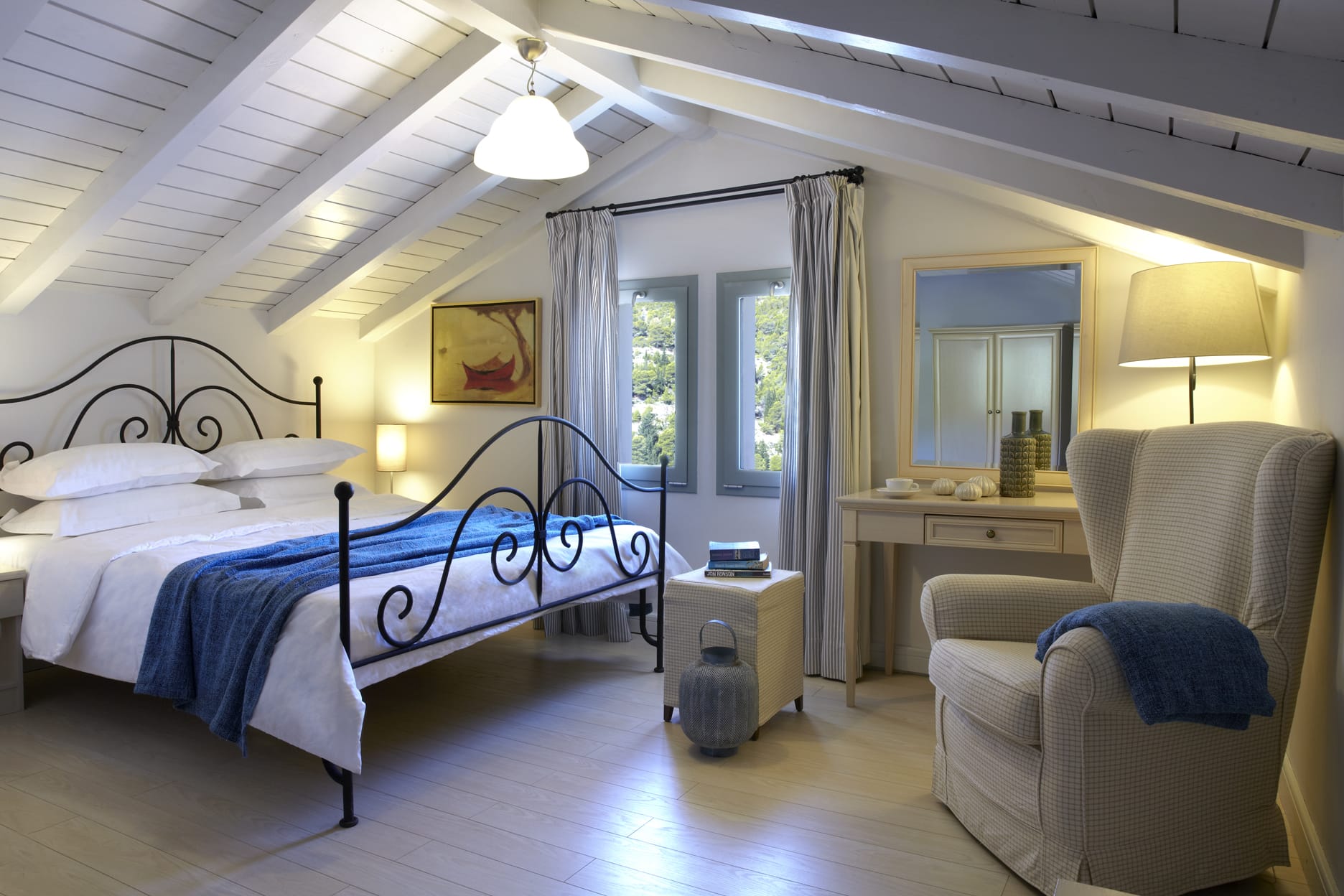 a bedroom with a bed and a chair