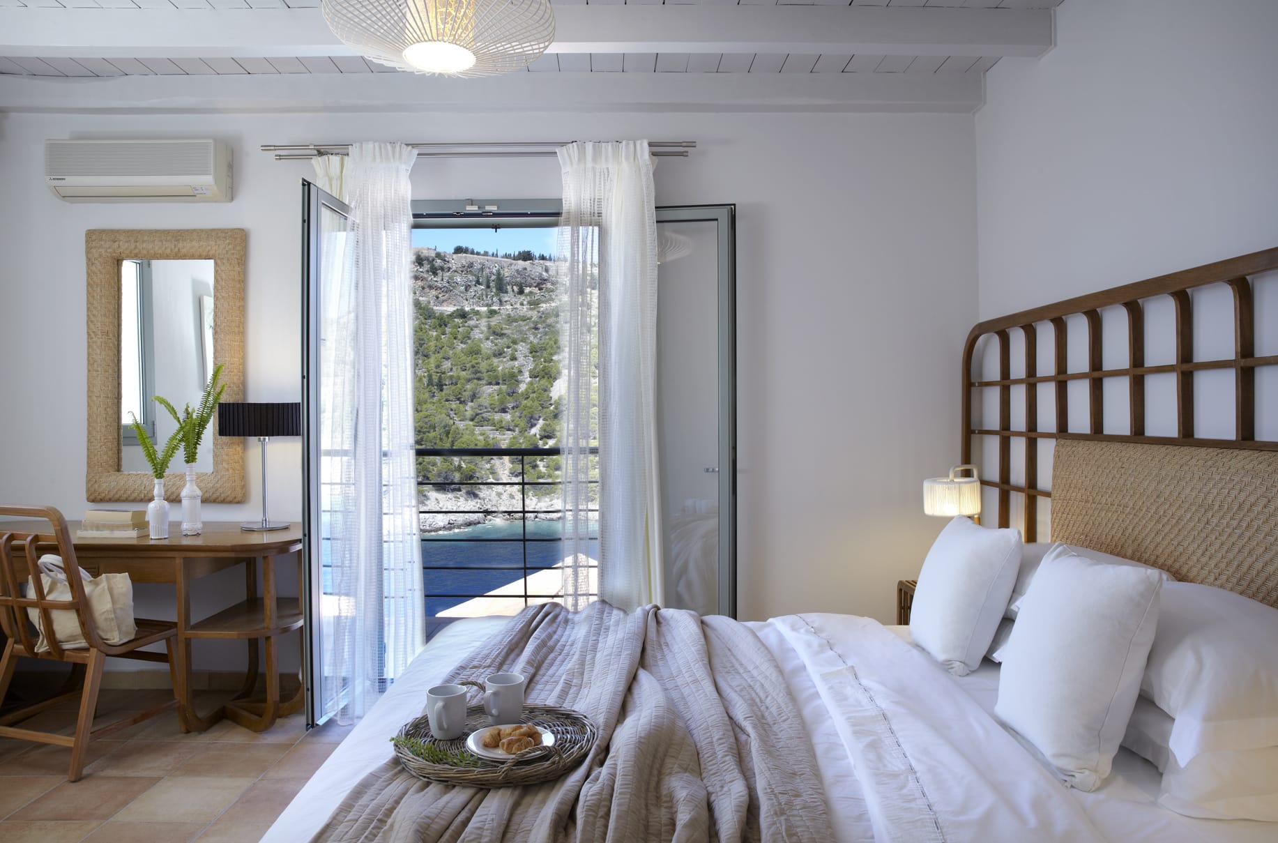 a bedroom with a large glass door