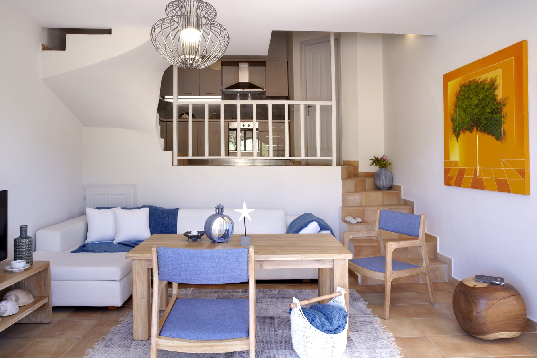 a living room with a table and chairs