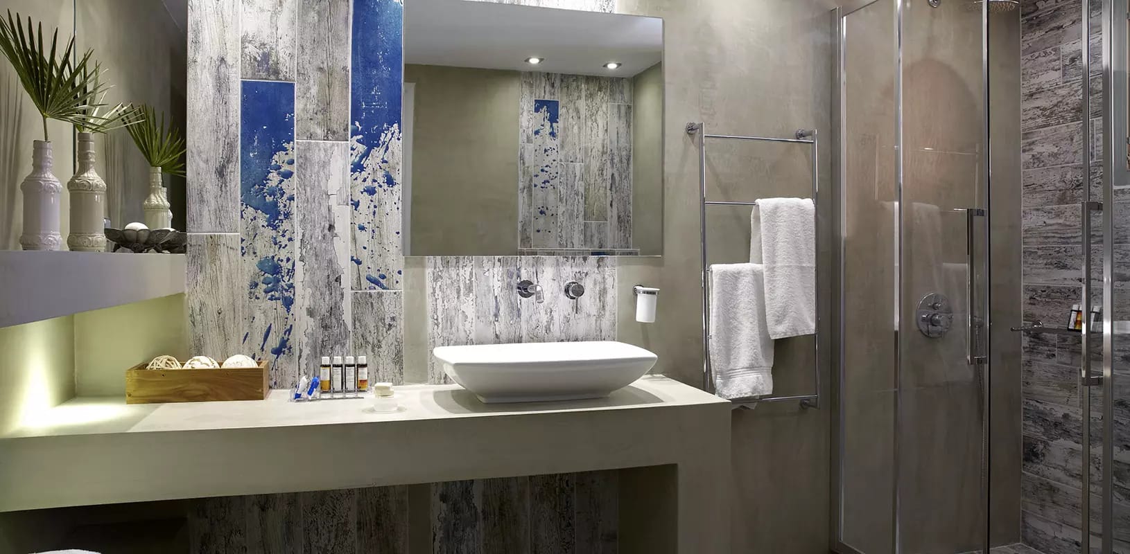 a bathroom with a sink and a shower unit