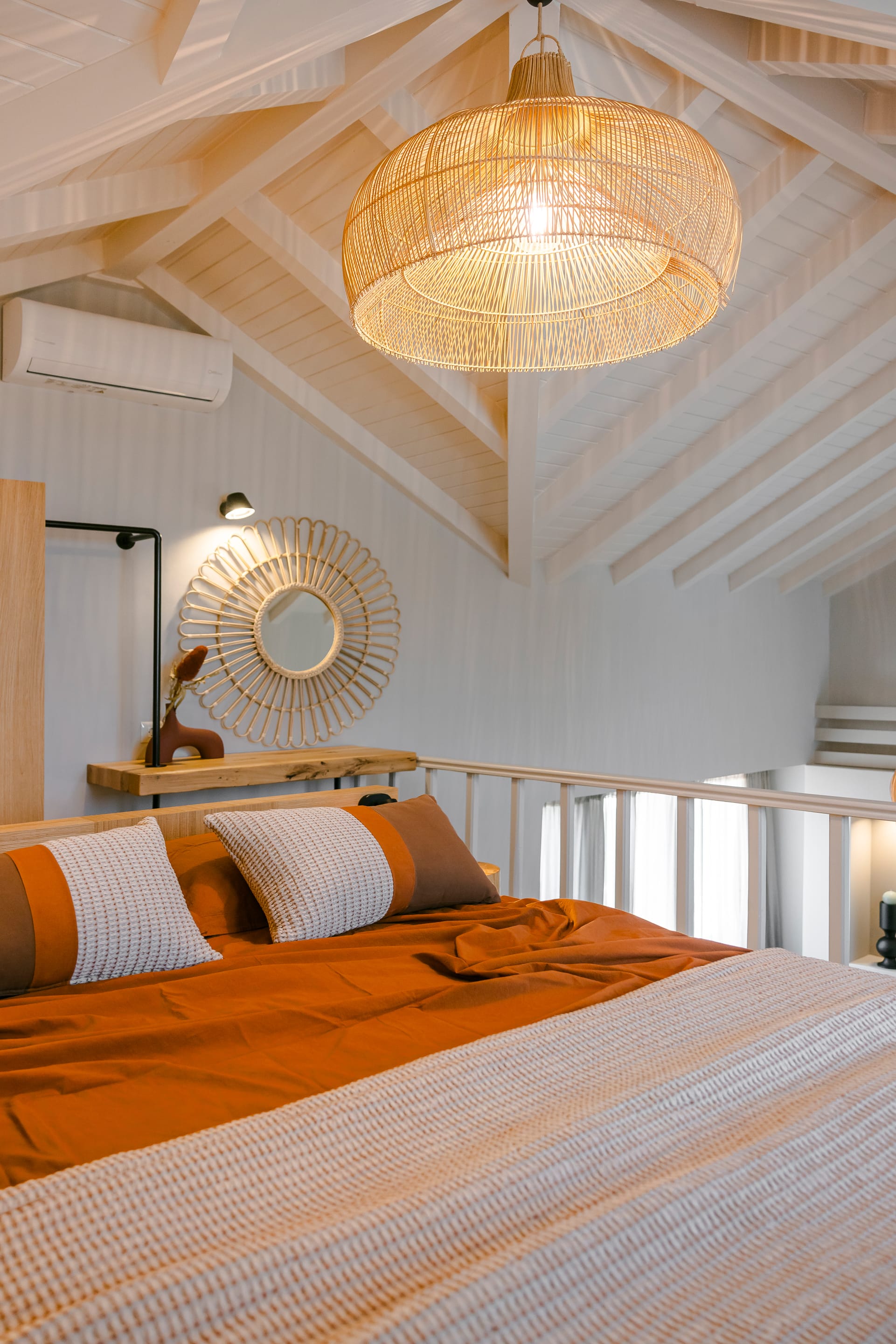 a bed with a lamp on it