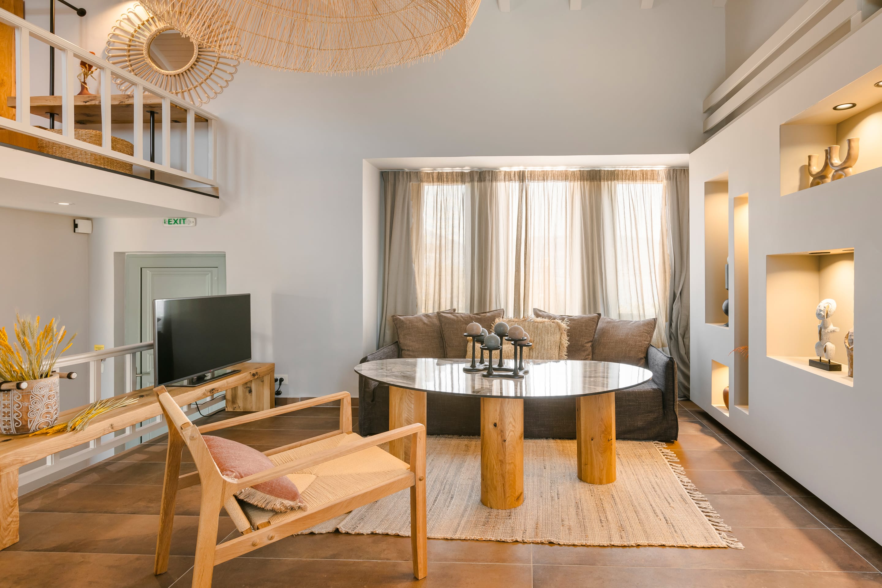 a living room with a table and chairs