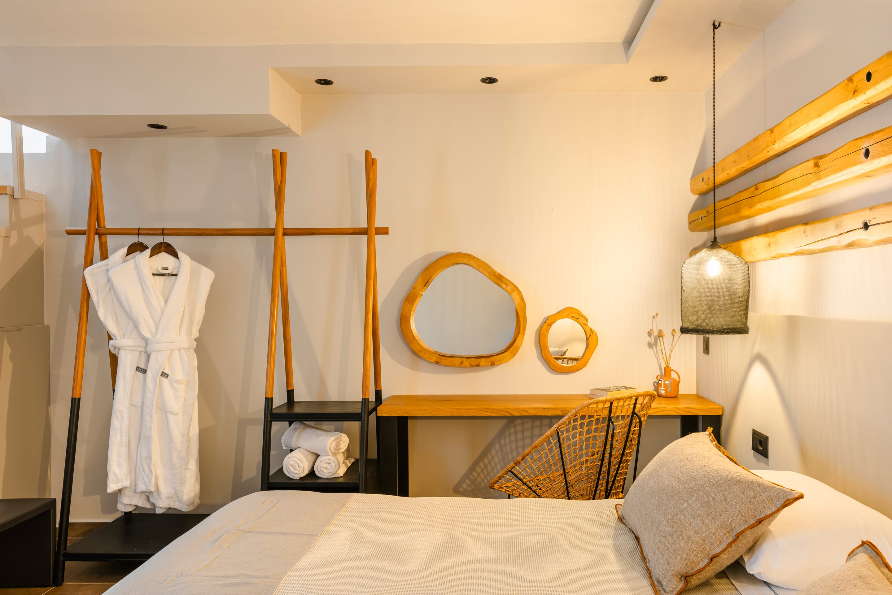 a bedroom with a bed and a mirror