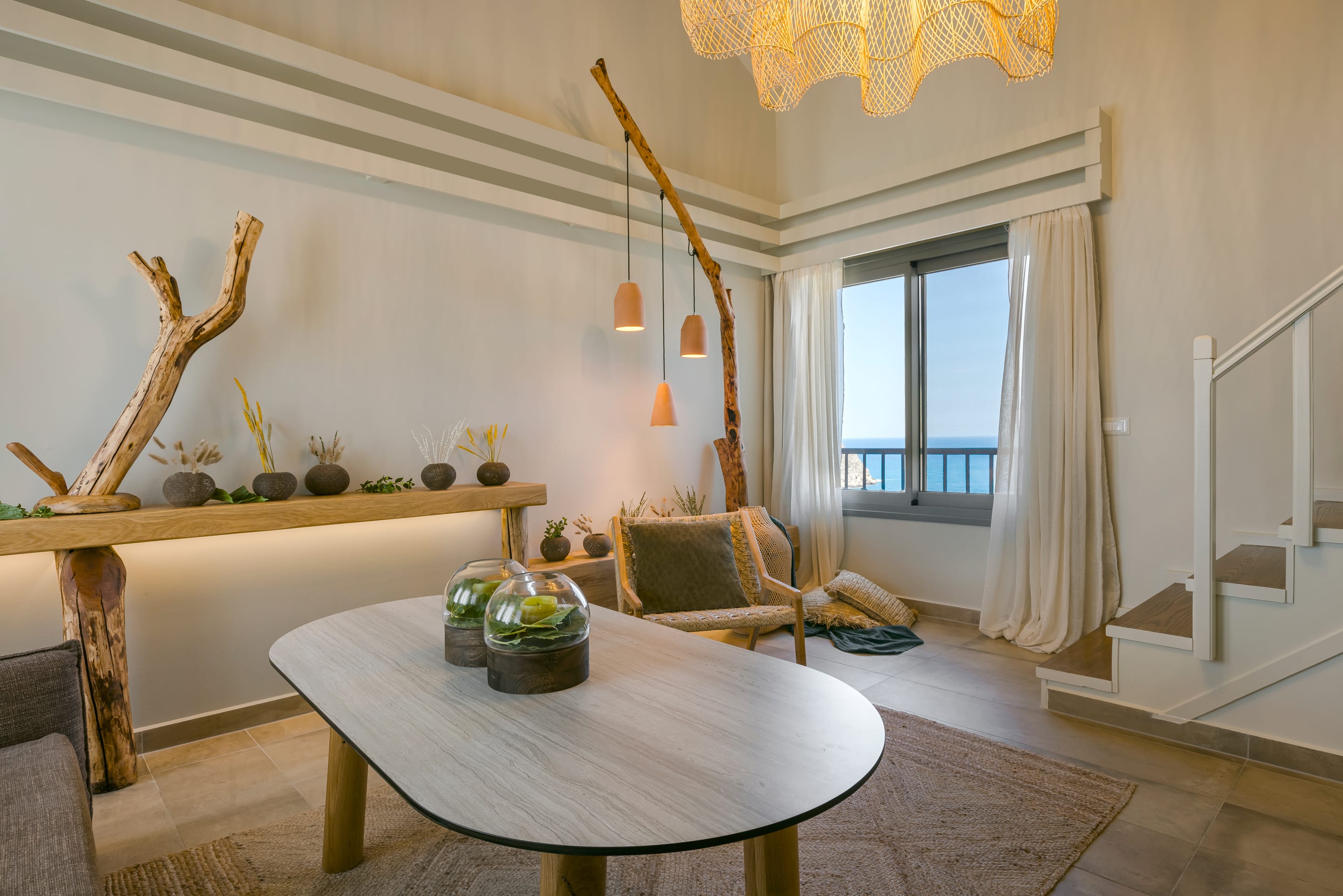 a living room with a table and chairs