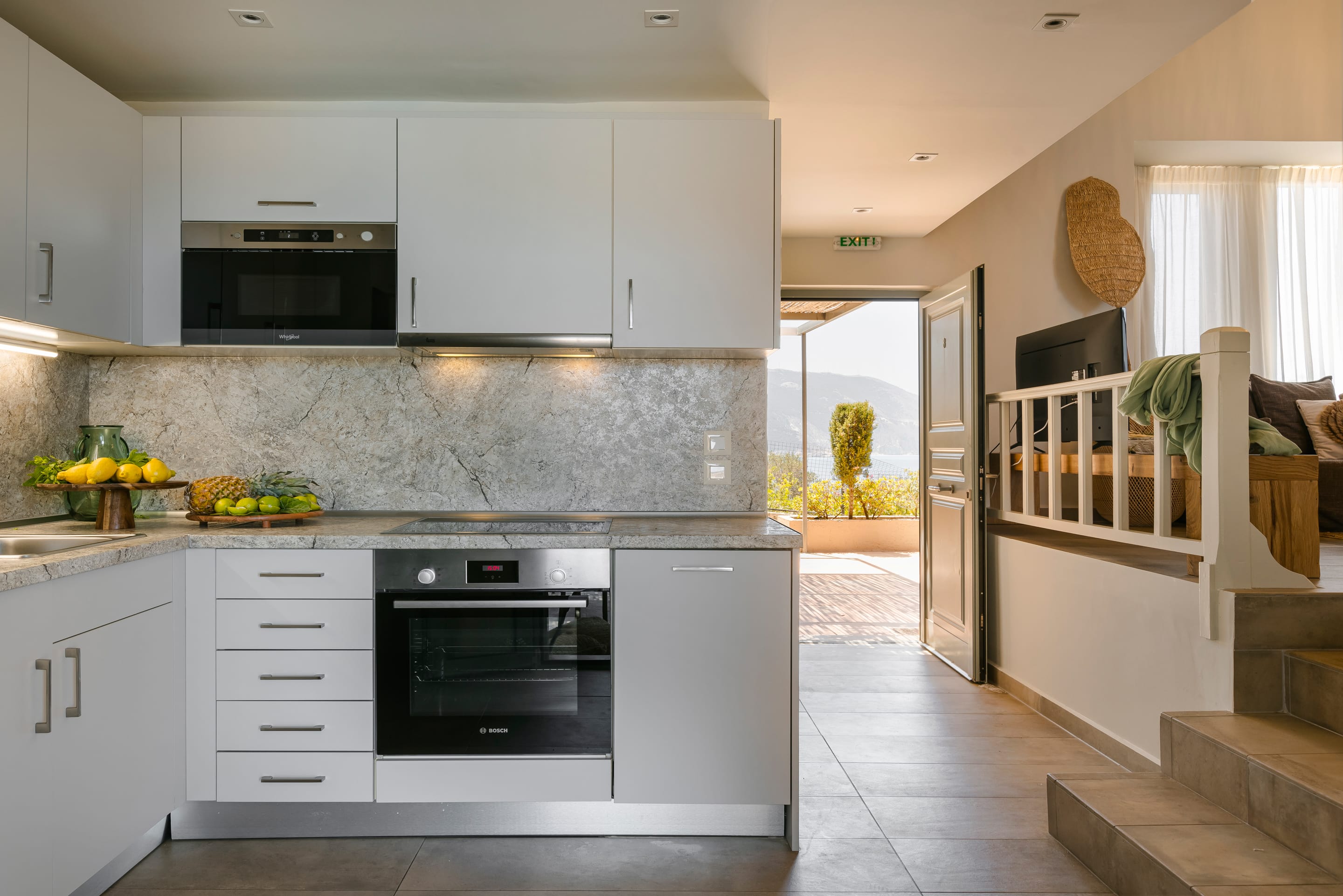 a kitchen with white cabinets