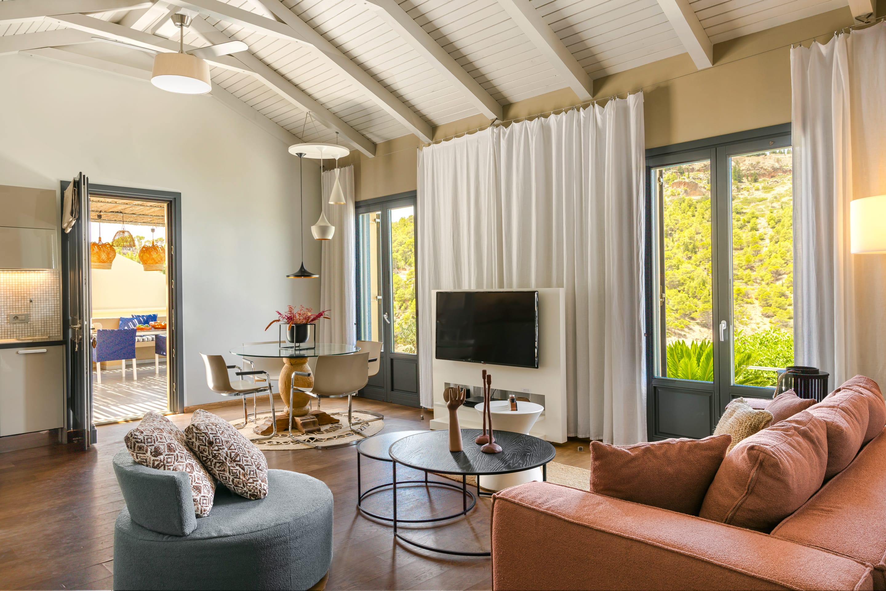 a living room with a tv and couches
