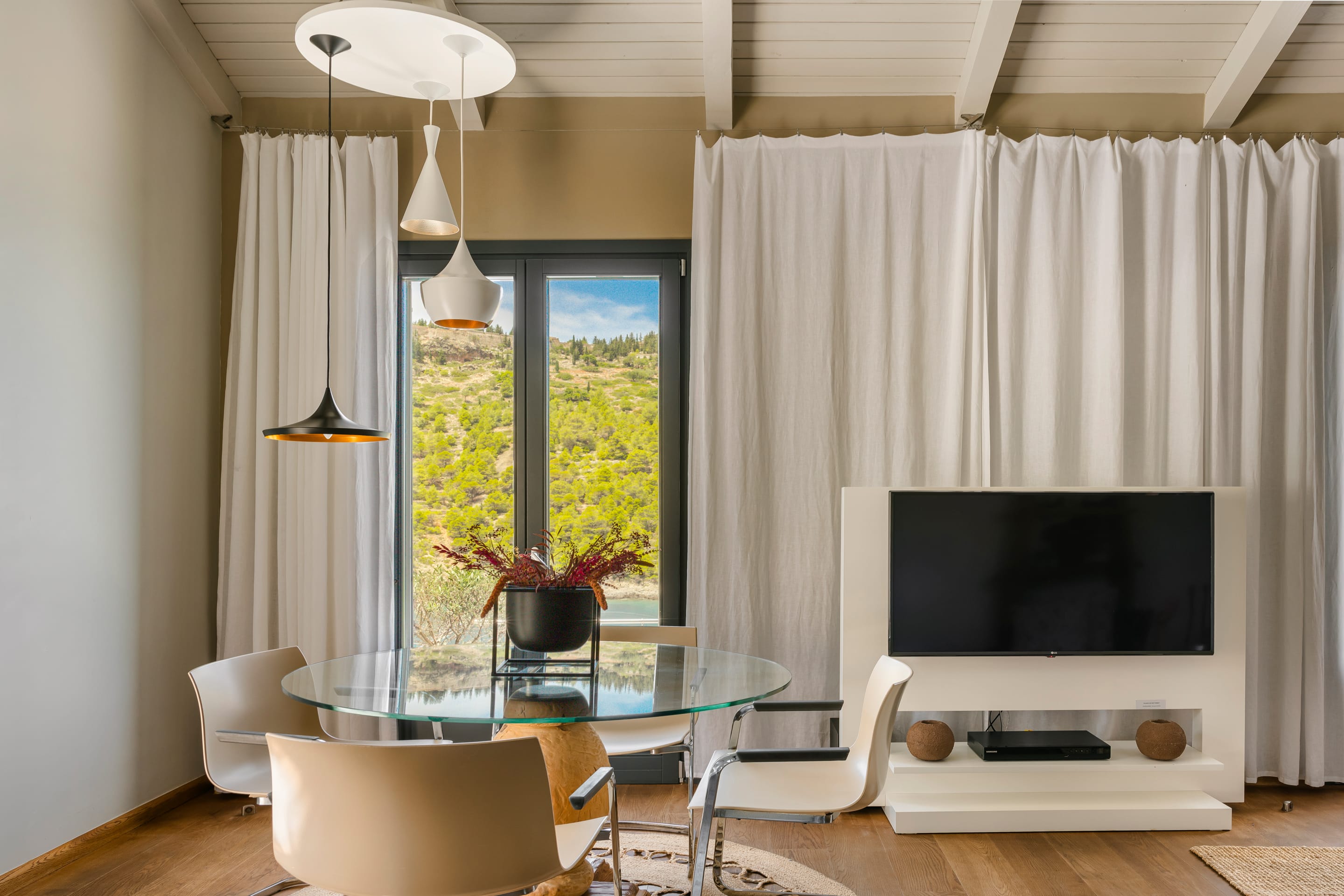 a living room with a tv and a table