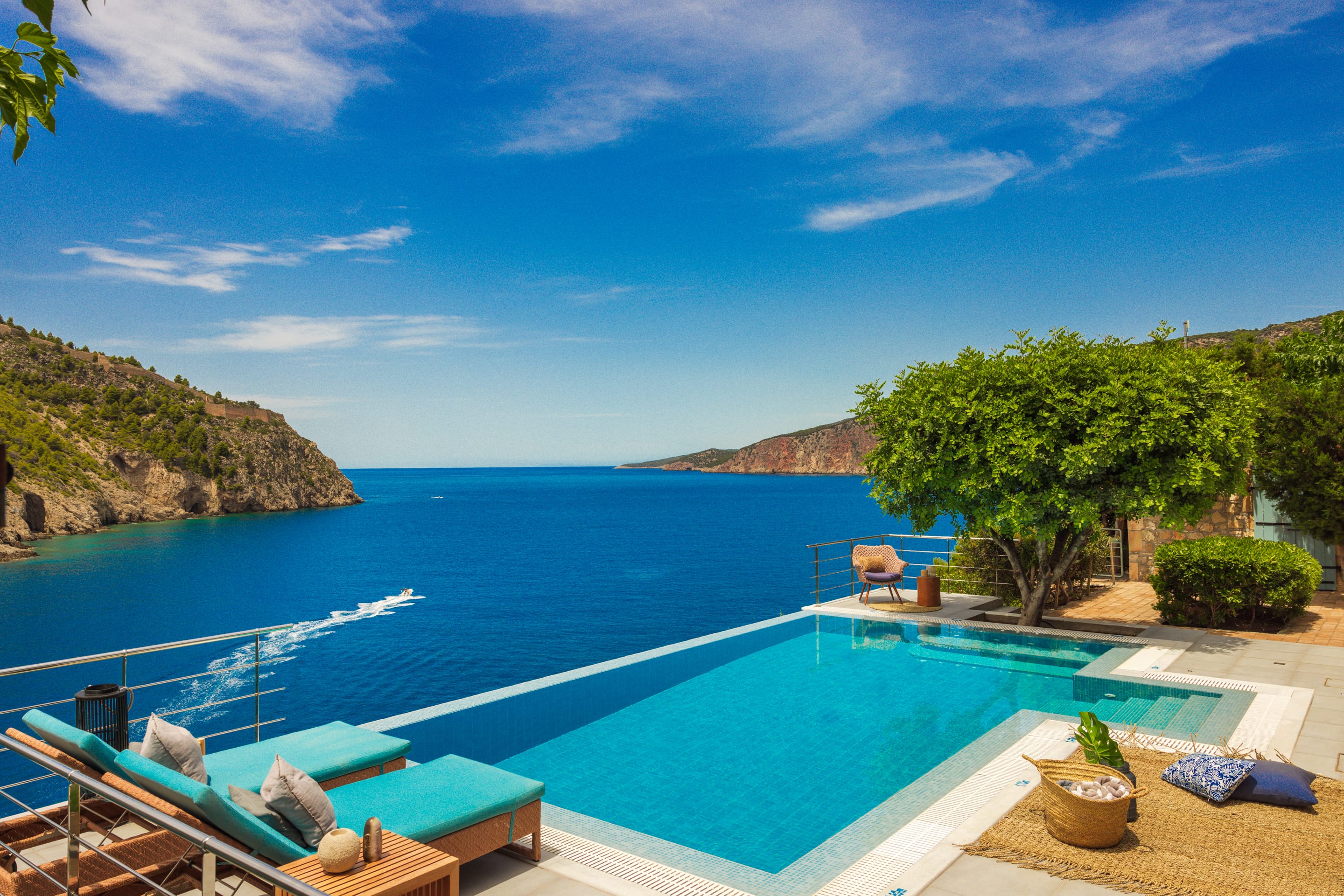 a pool with a deck and trees by it