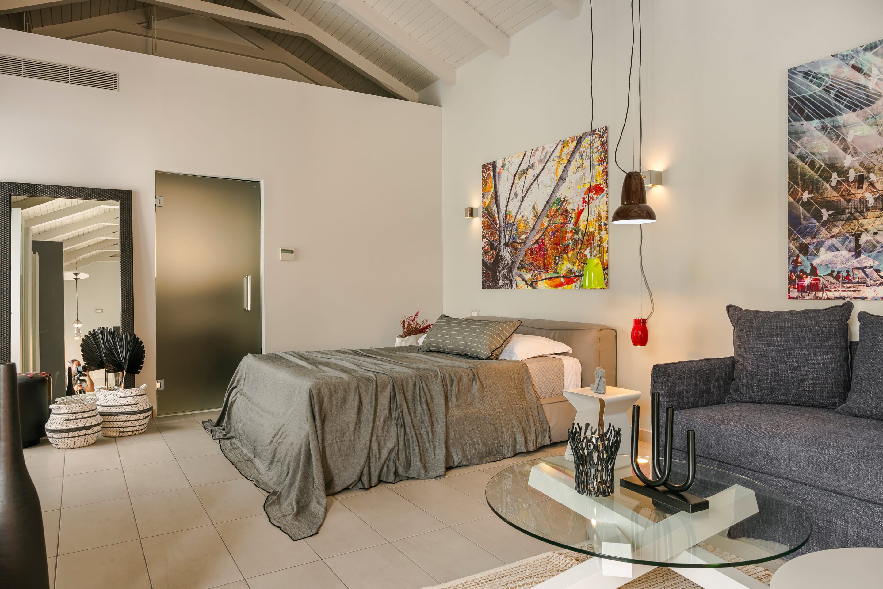 a bedroom with a bed and a couch